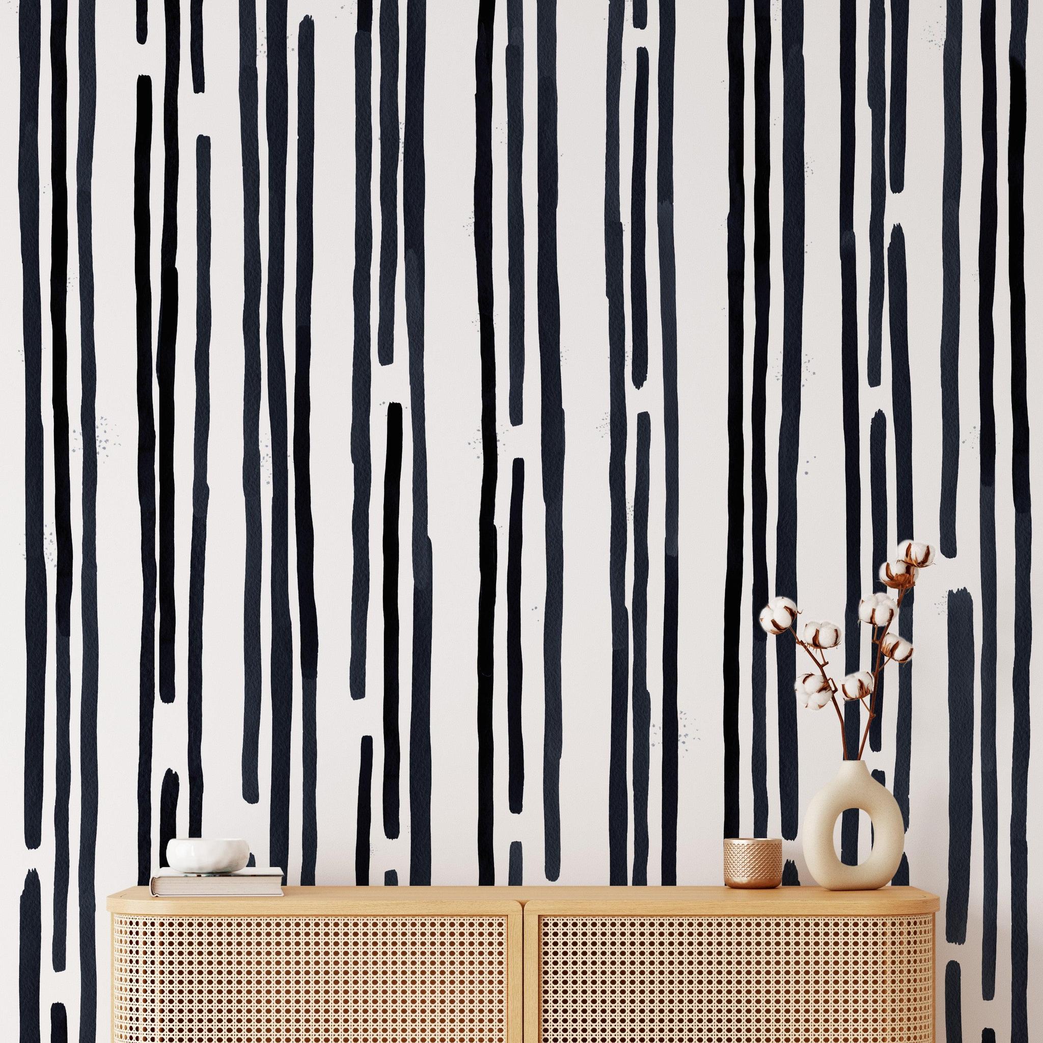 Stripped by Spencer Wallpaper from The Tamra Judge Line installed in a modern living room, focusing on wall detail.