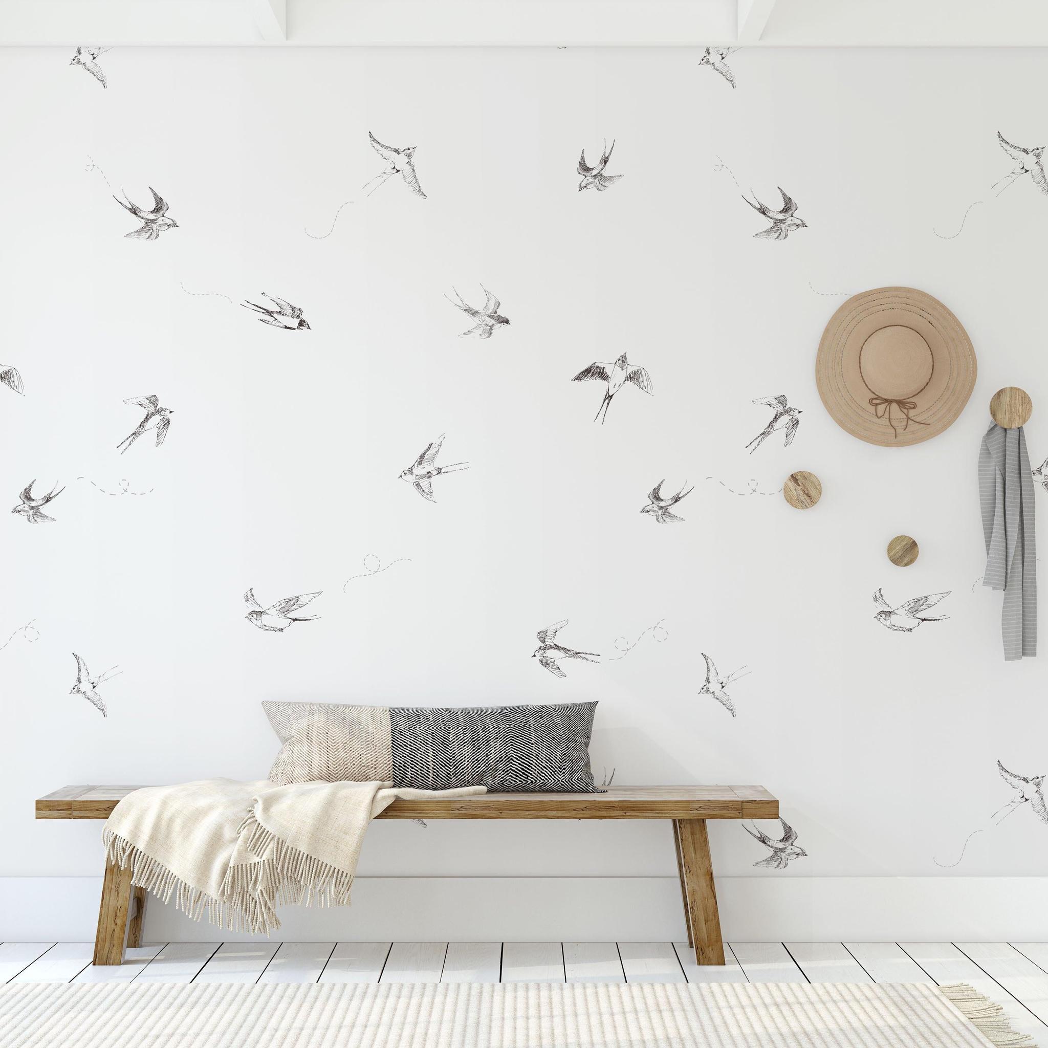 "Minimalistic living room featuring Wall Blush 'Of a Feather (White) Wallpaper' design on wall."