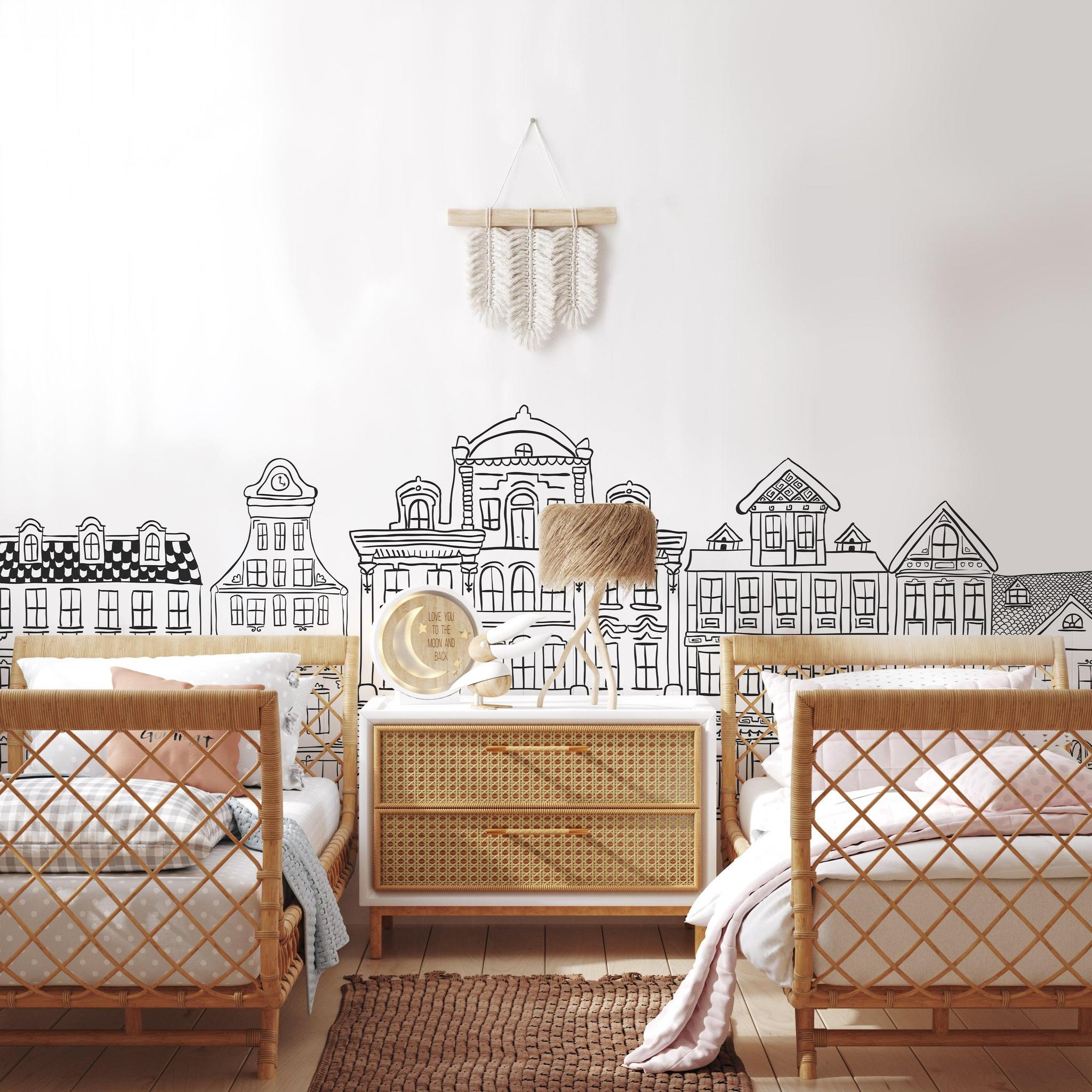 Madeline (White) Wallpaper by Wall Blush adorning nursery walls with elegant building sketches.