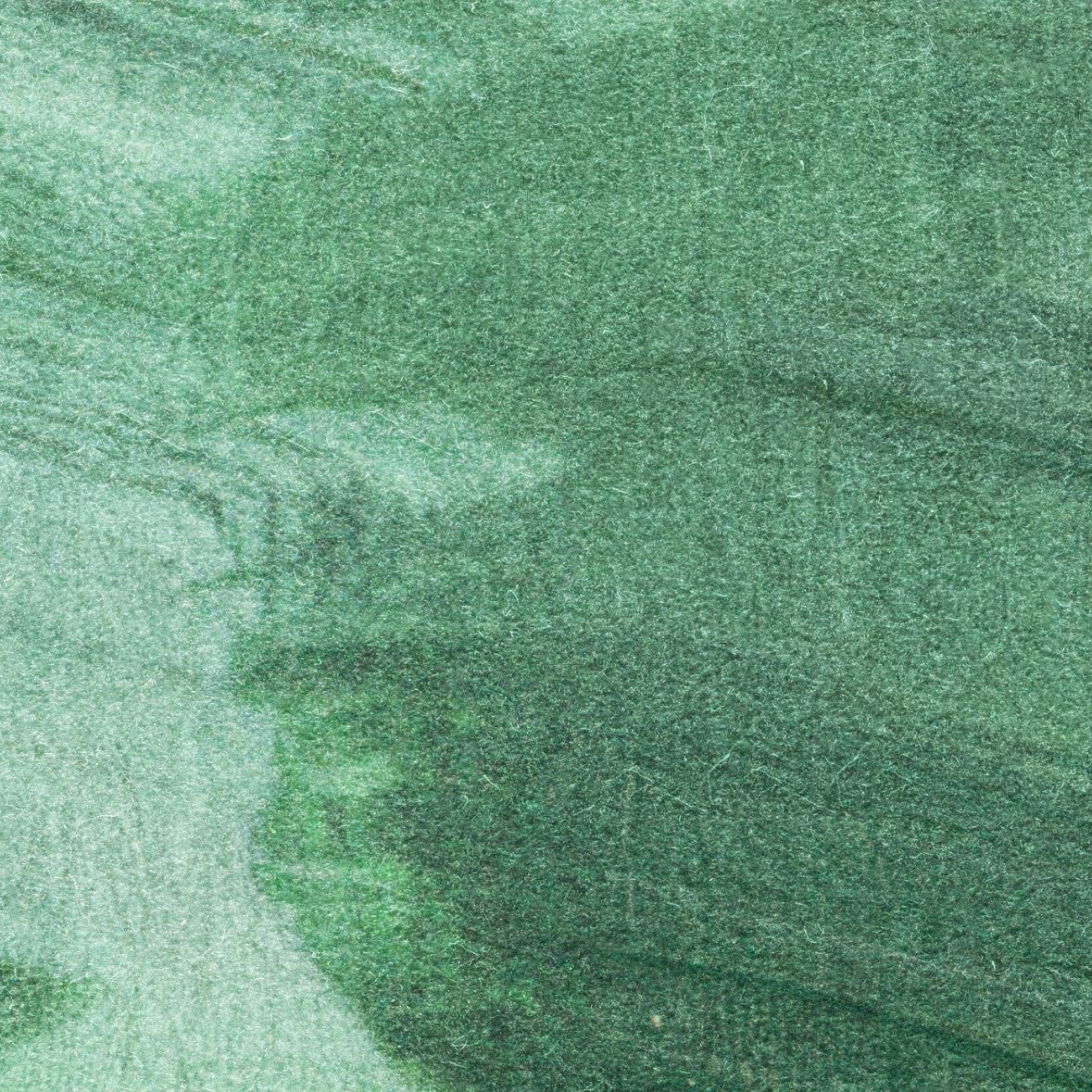 Emerald Wallpaper by Wall Blush SG02 featured in modern living room, highlighting texture and vibrant green hues.