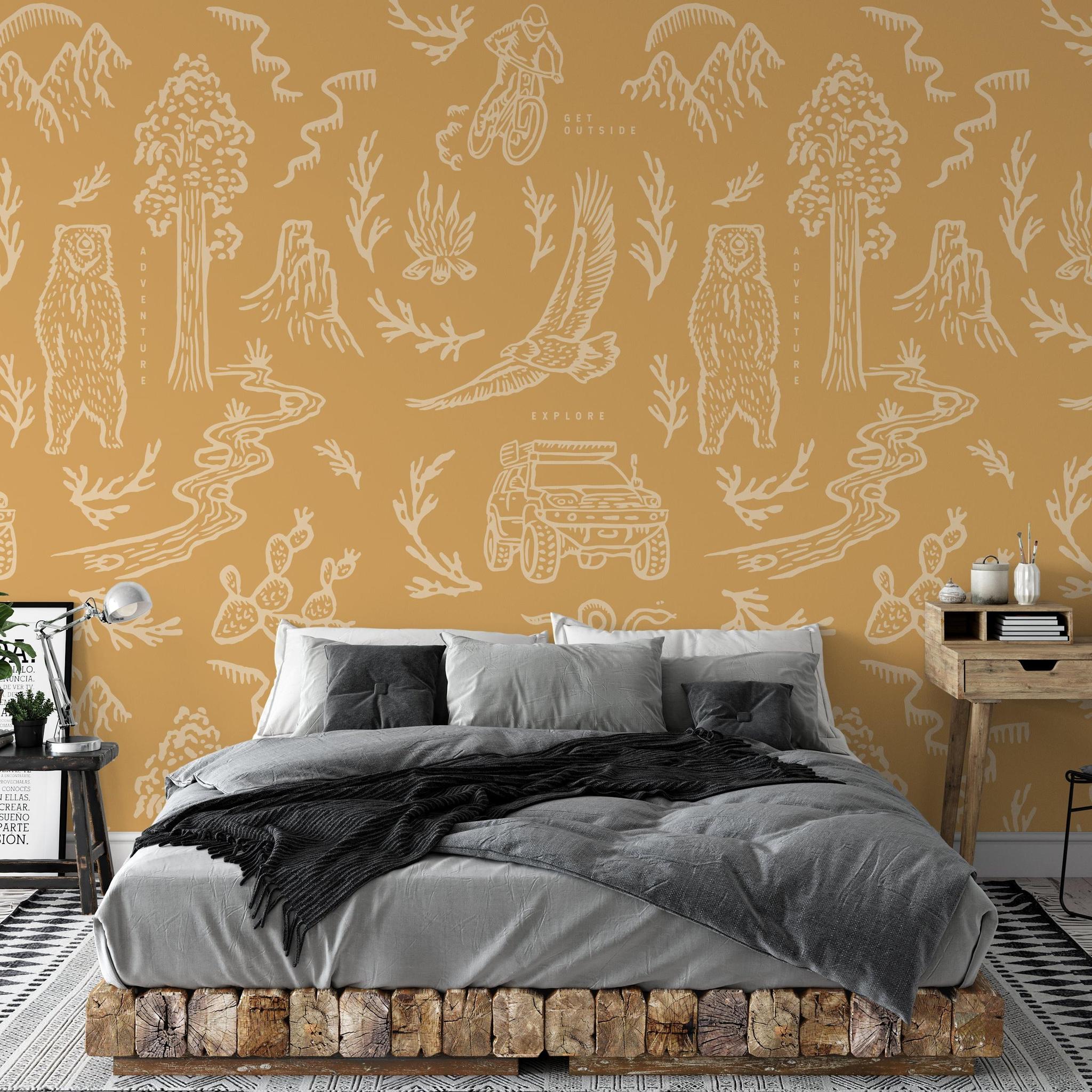 The Rayco Line 'Adventure Awaits (Orange) Wallpaper' featured in an elegant bedroom setup, emphasizing the vibrant design.
