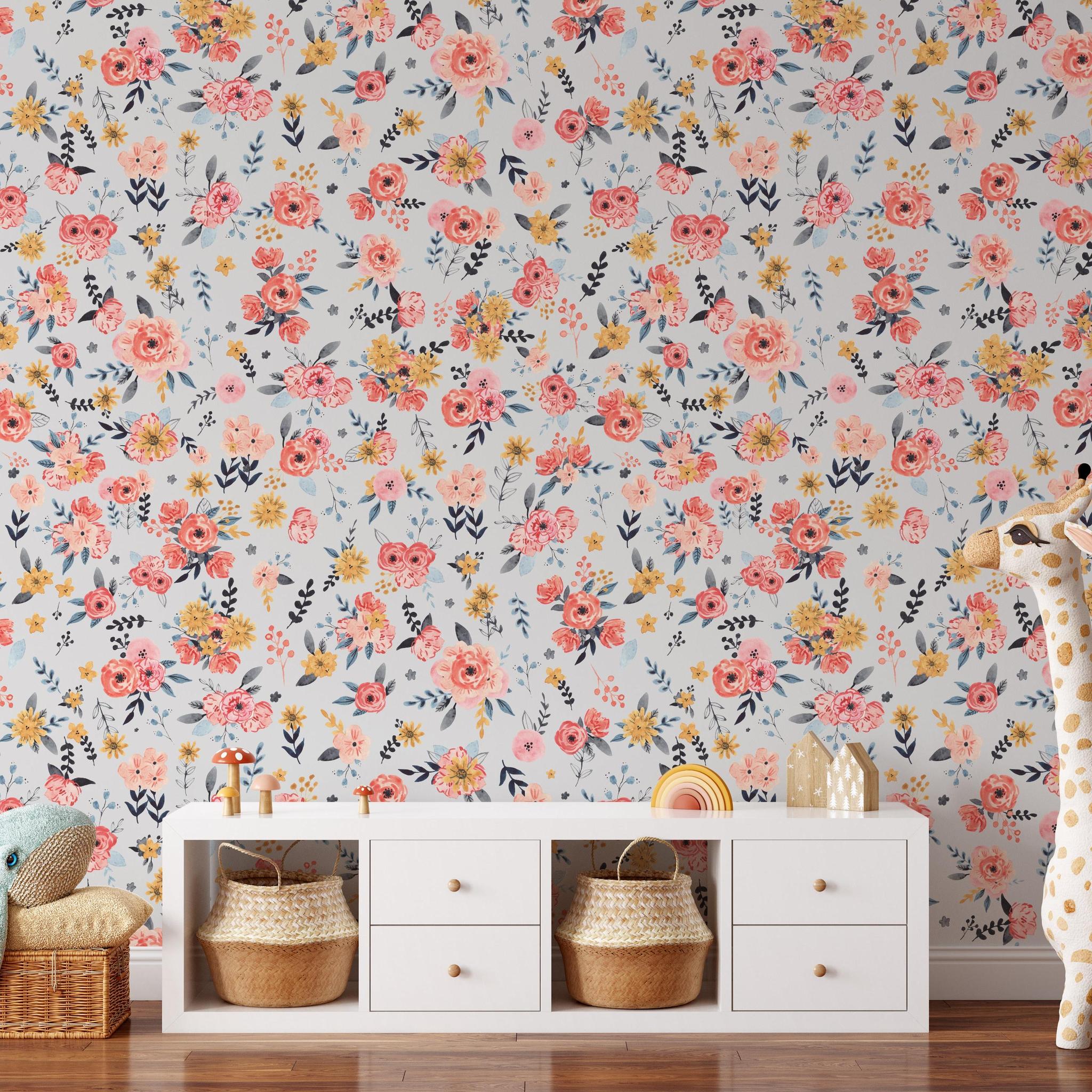 In Bloom (Silver) Wallpaper by Wall Blush adorning a stylish nursery room, with vivid floral patterns as the focus.