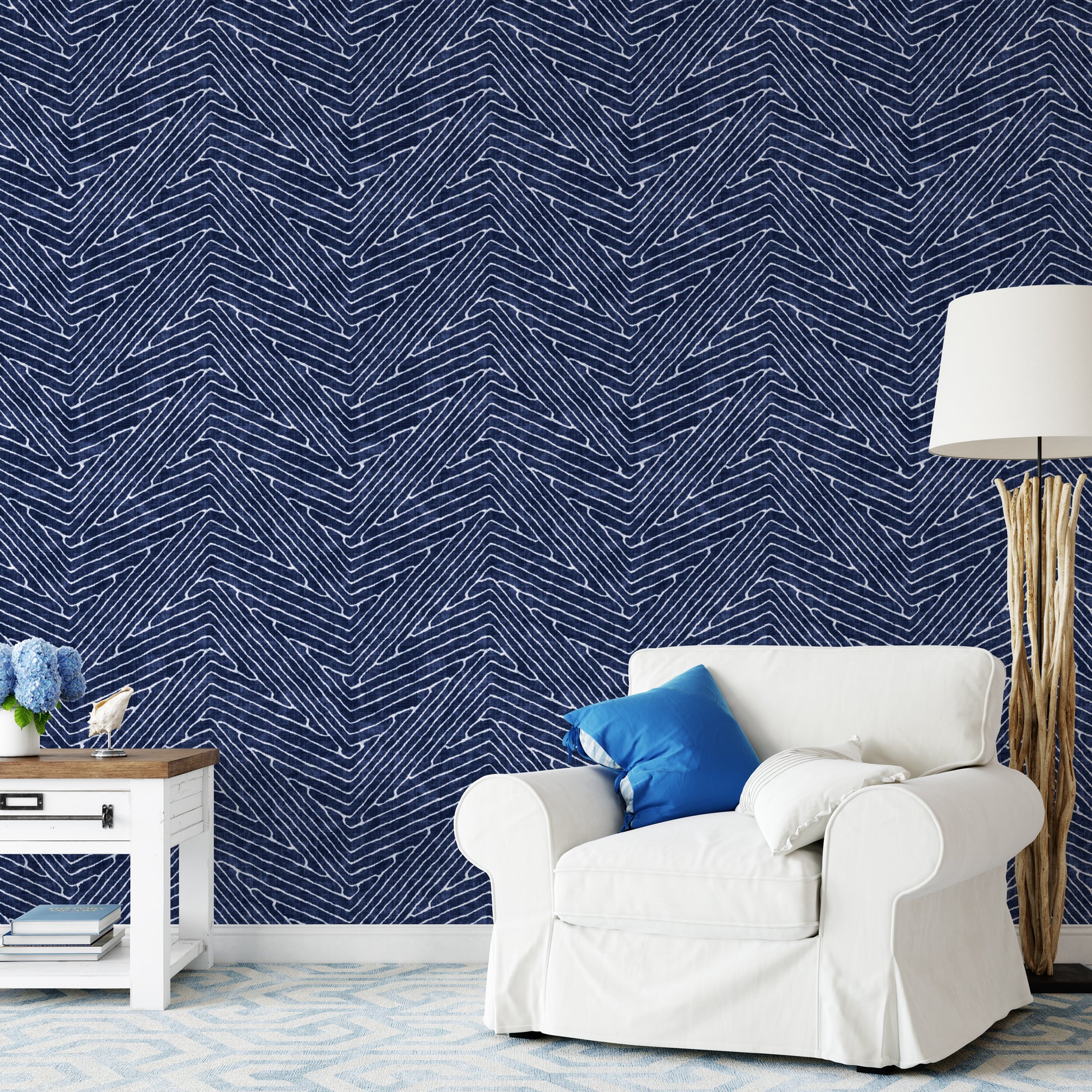 "Wall Blush's Windsor Wallpaper in a stylish living room, featuring a pronounced herringbone pattern."