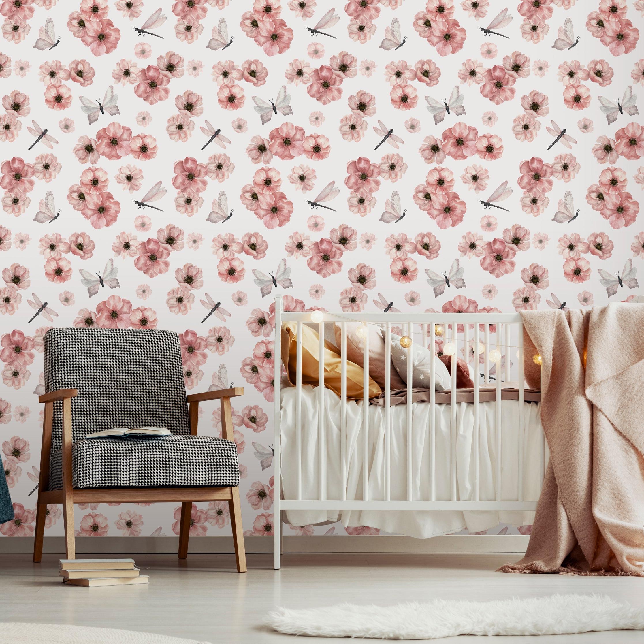 Wall Blush's Dragonlily (White) Wallpaper in a baby room with crib and chair, floral wall accent.