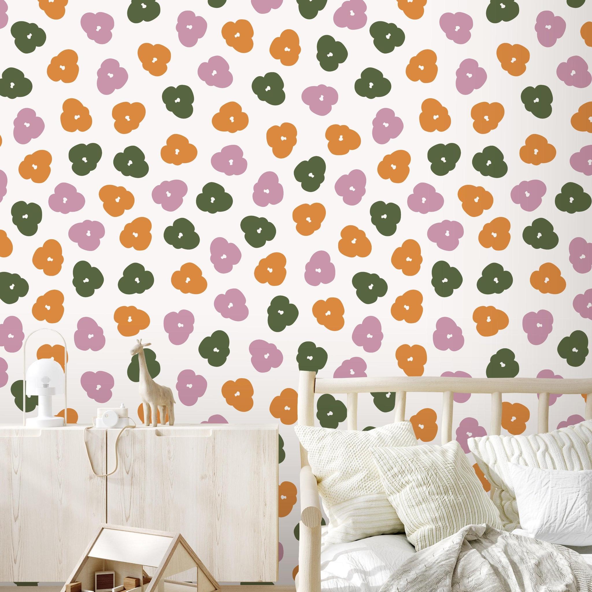 Alt: Colorful Let's Hang Wallpaper by Wall Blush SG02 featured in a cozy nursery room, with playful animal patterns.