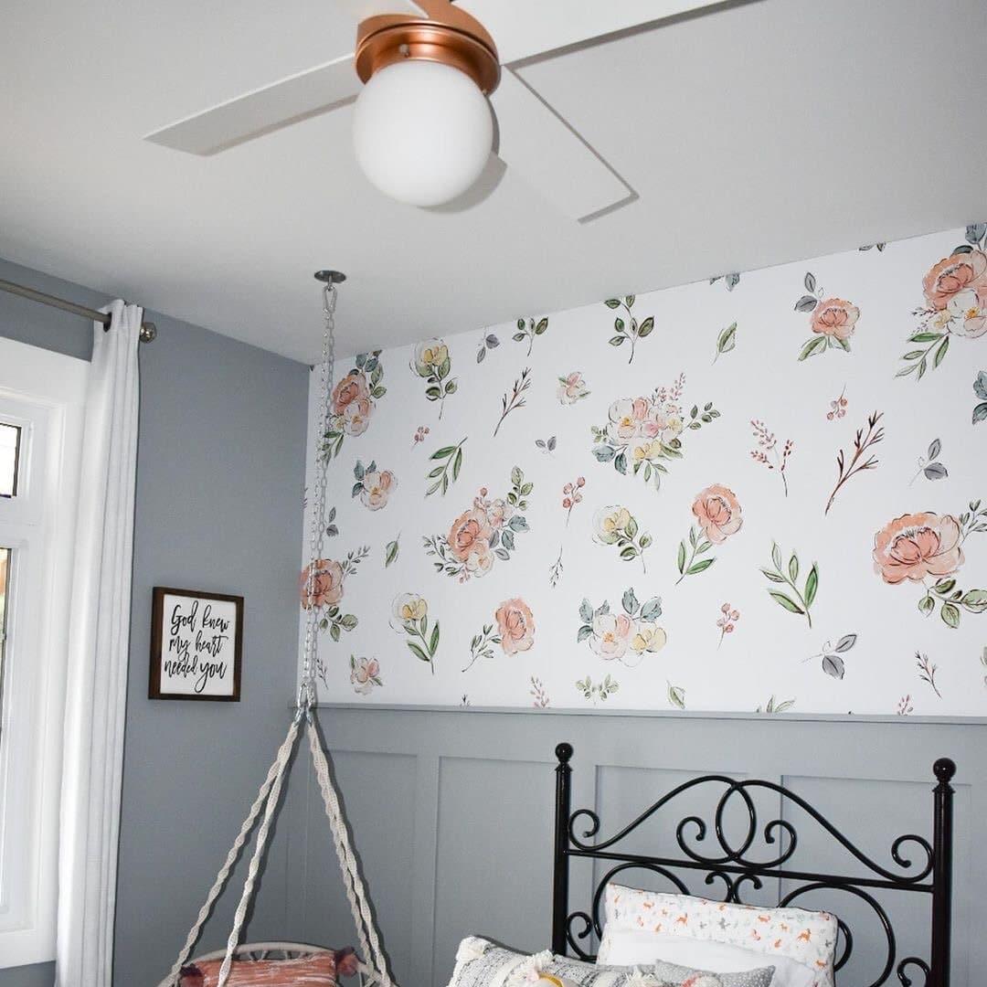 Wall Blush 'The Cosette' floral wallpaper enhancing the charm of a cozy bedroom setup.