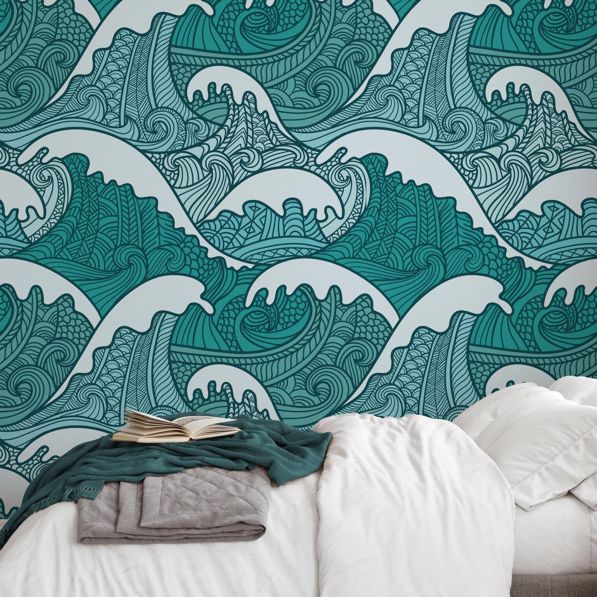 Stylish bedroom featuring Wall Blush's Maui Wallpaper with intricate teal wave patterns on the accent wall.