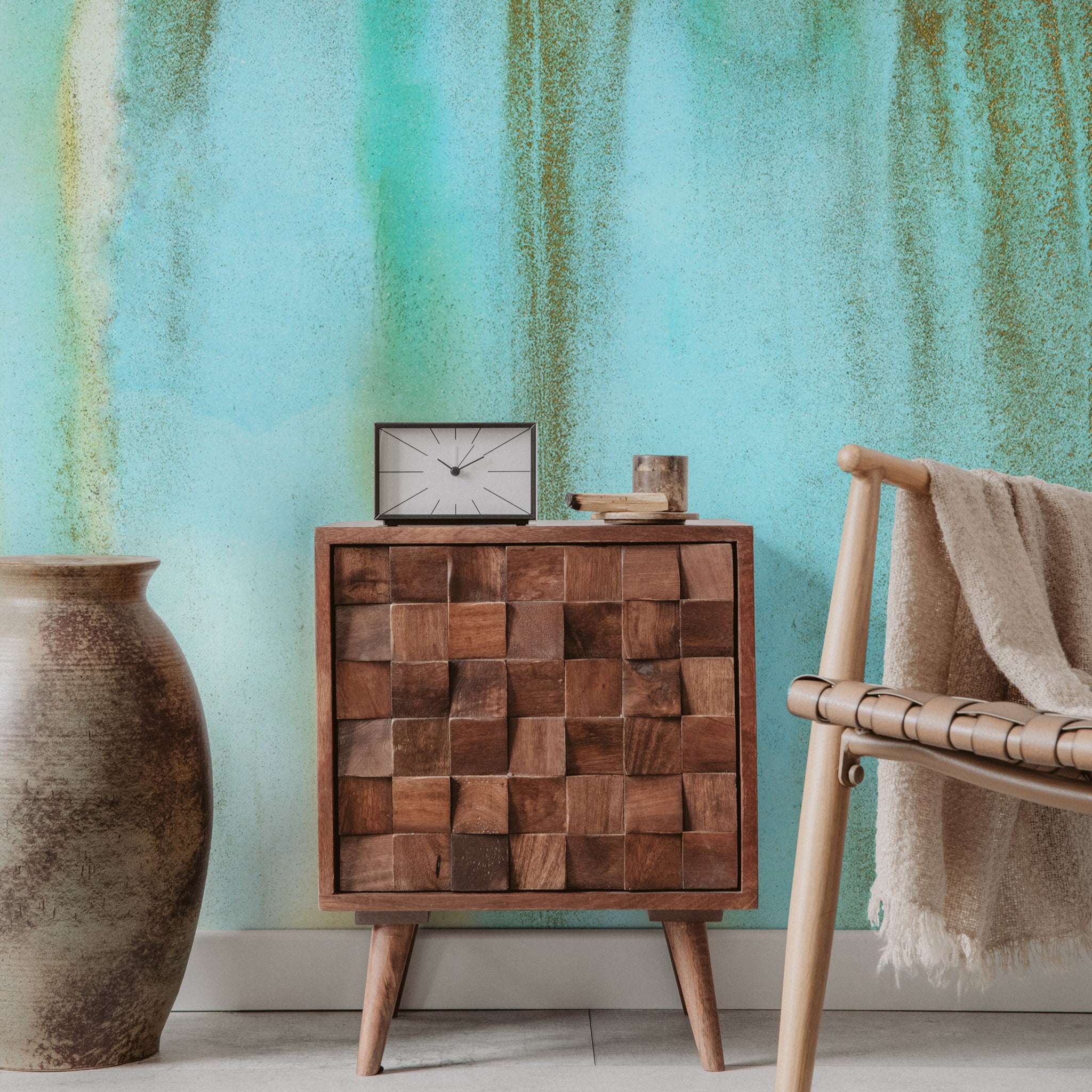 "Wall Blush Venice Wallpaper in a modern living room with decorative wooden furniture and cozy accents"