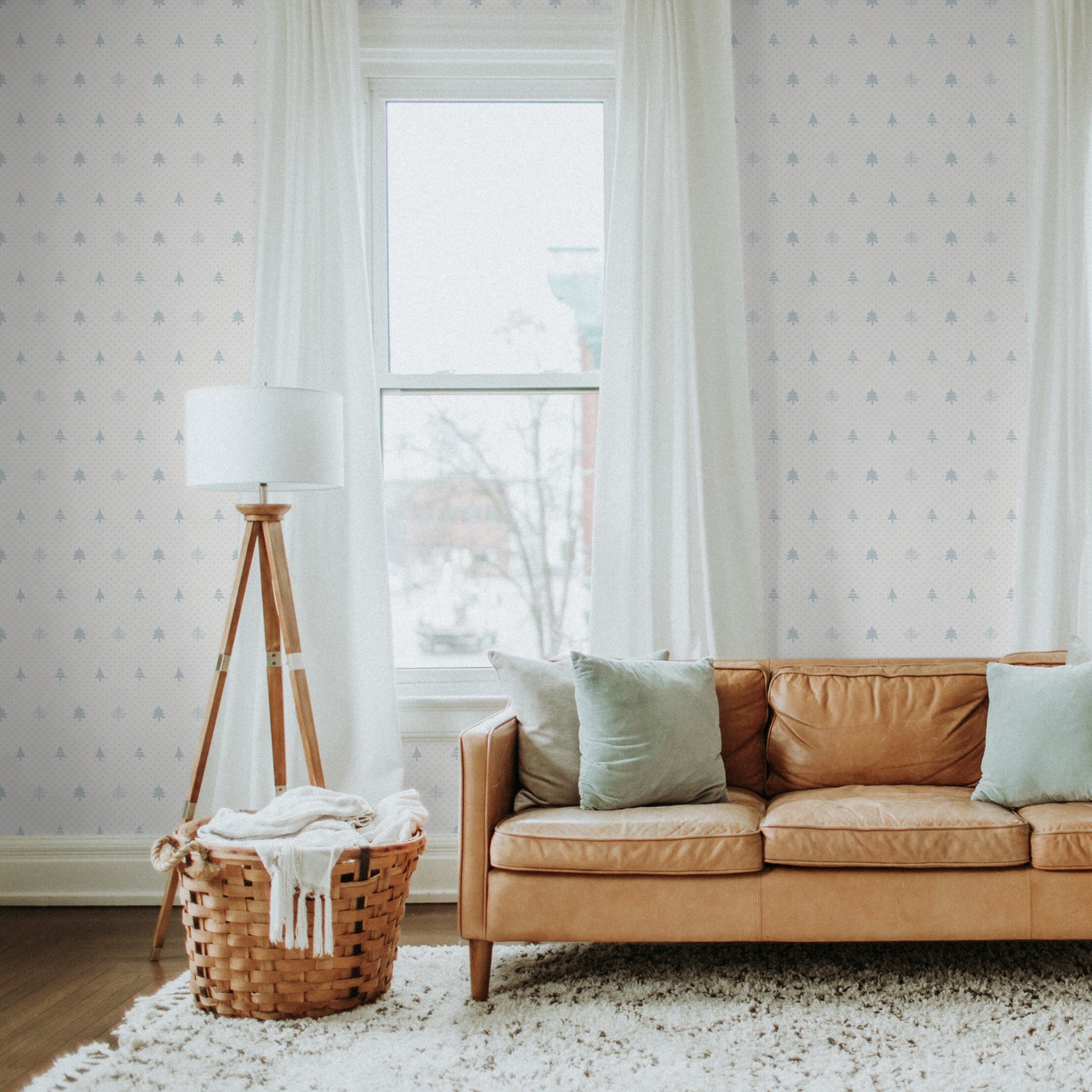 Alt: "Elegant living room featuring Noble Wallpaper by Wall Blush with subtle tree patterns enhancing the cozy, stylish décor."