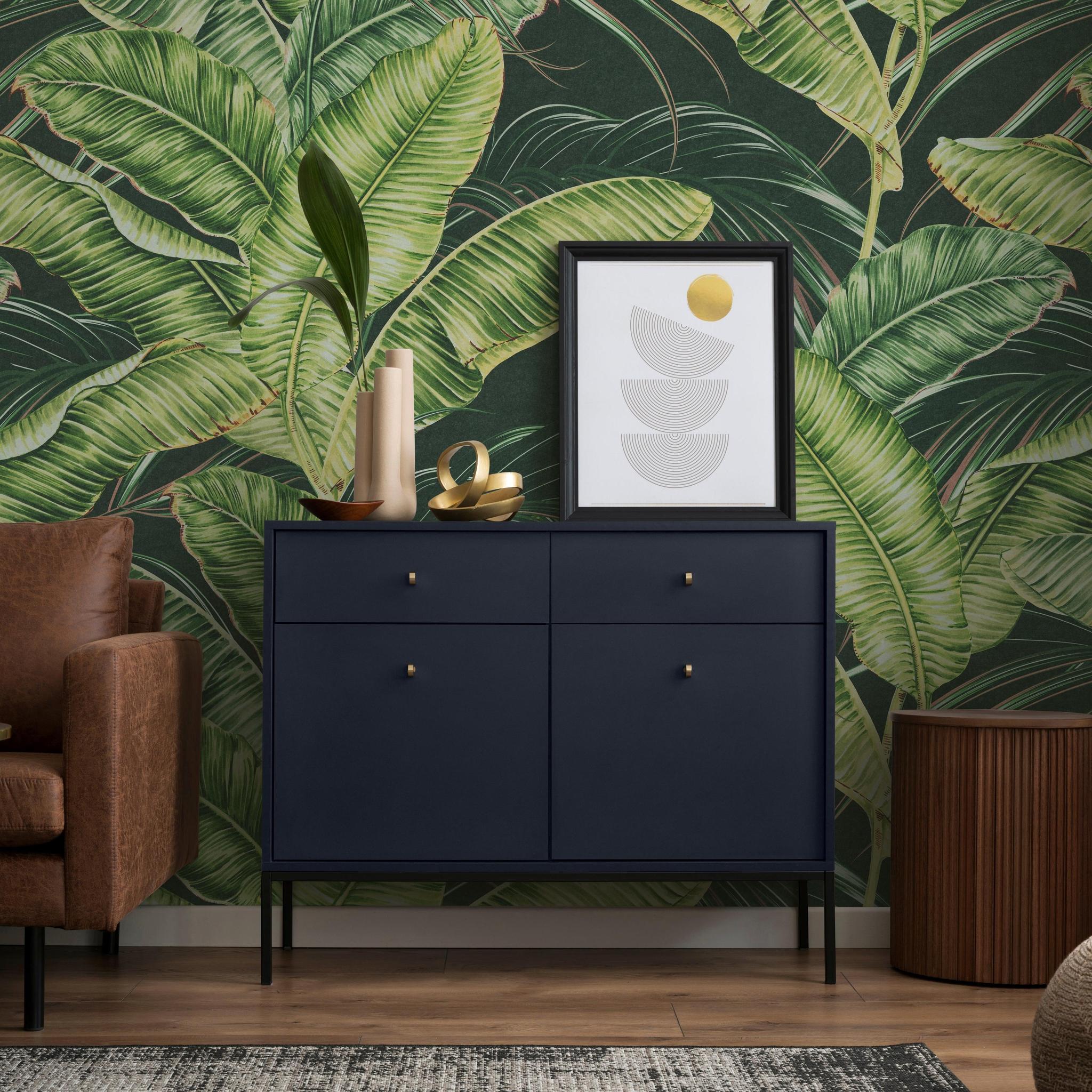 Sterlitzia Wallpaper by Wall Blush SG02 featuring in a modern living room with chic decor and furniture.
