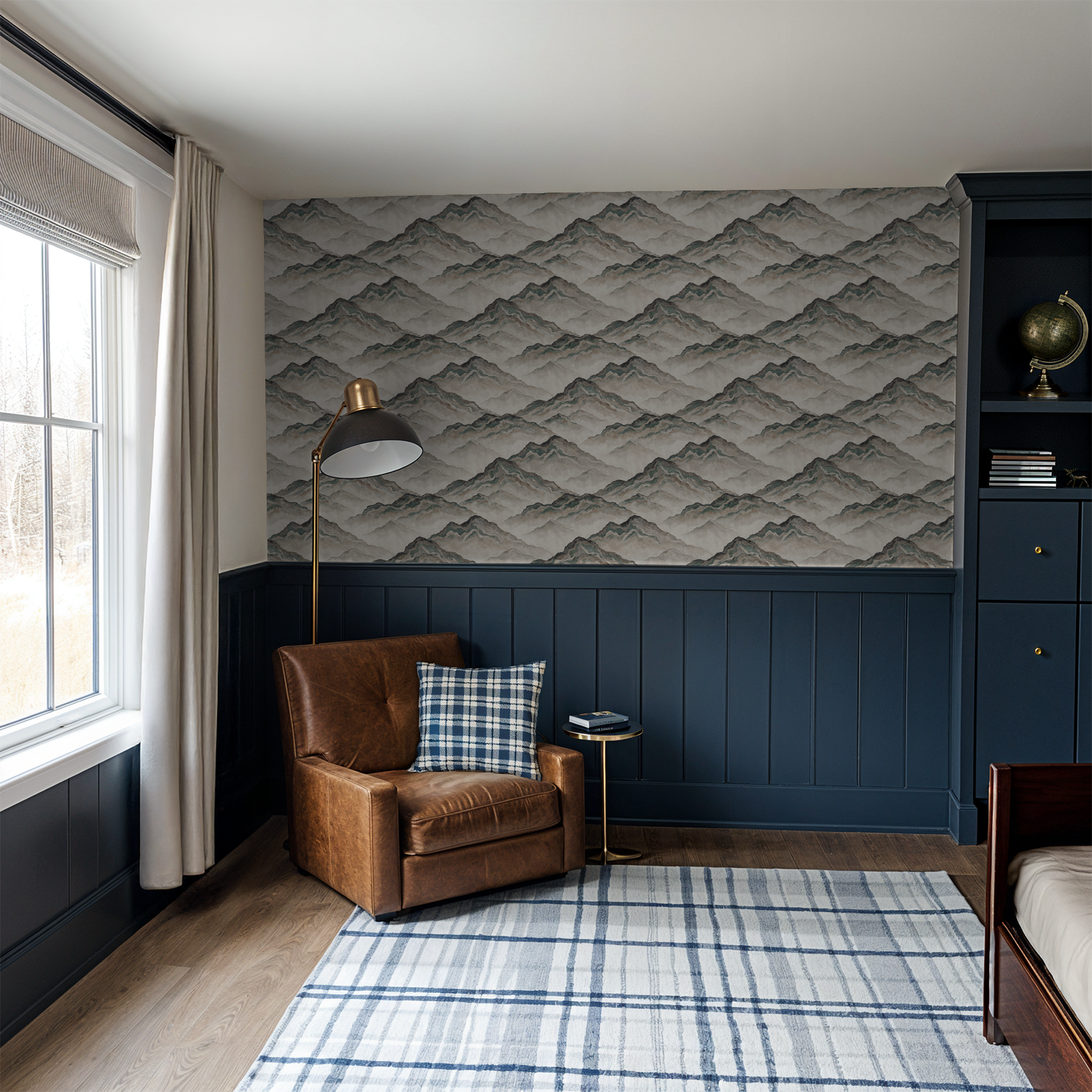 Mountain wave wallpaper in earthy tones in a cozy living room with leather chair.