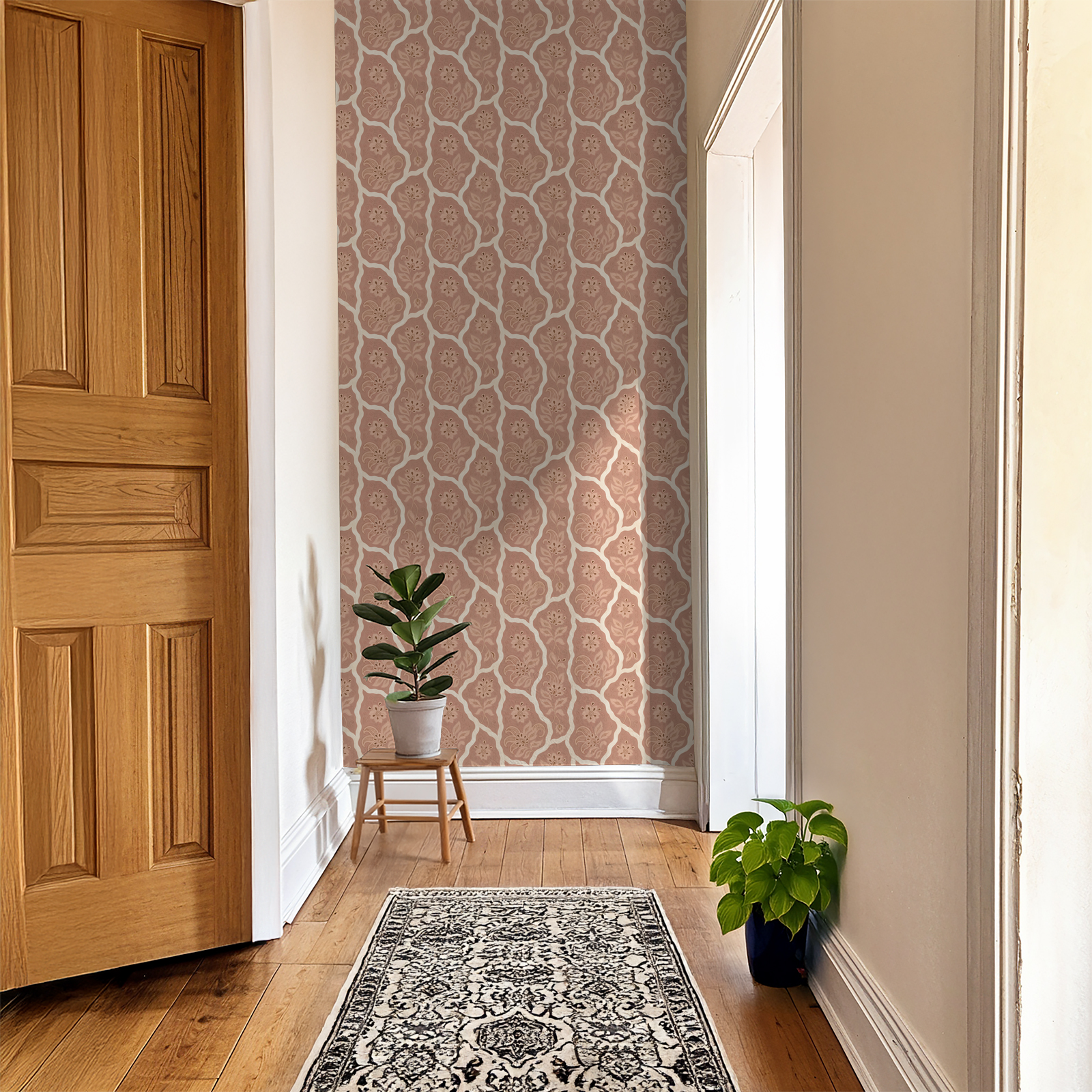 Bloomington blush floral wallpaper in hallway with plants and wooden floor