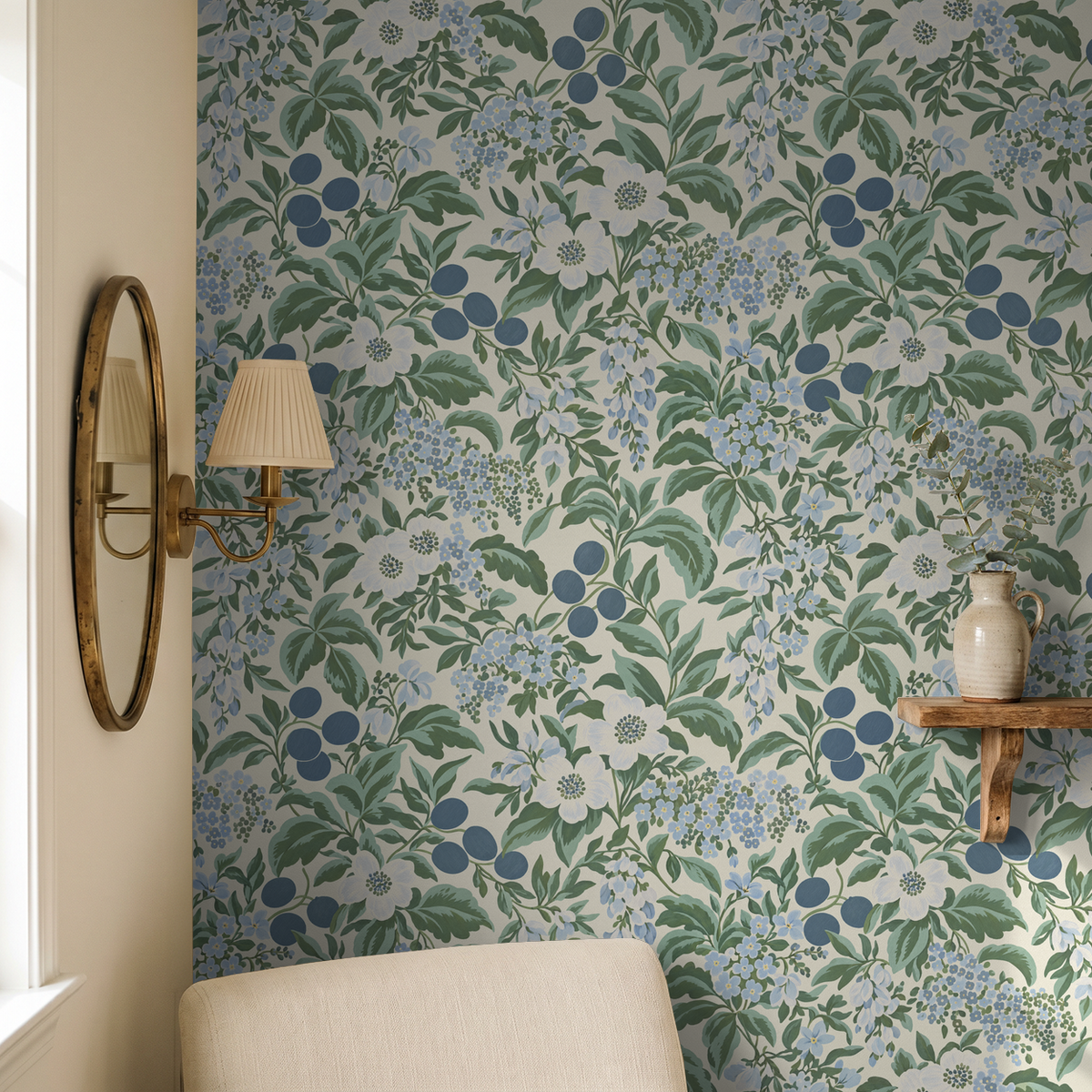 Floral wallpaper with blue and green botanical pattern in cozy room setting.