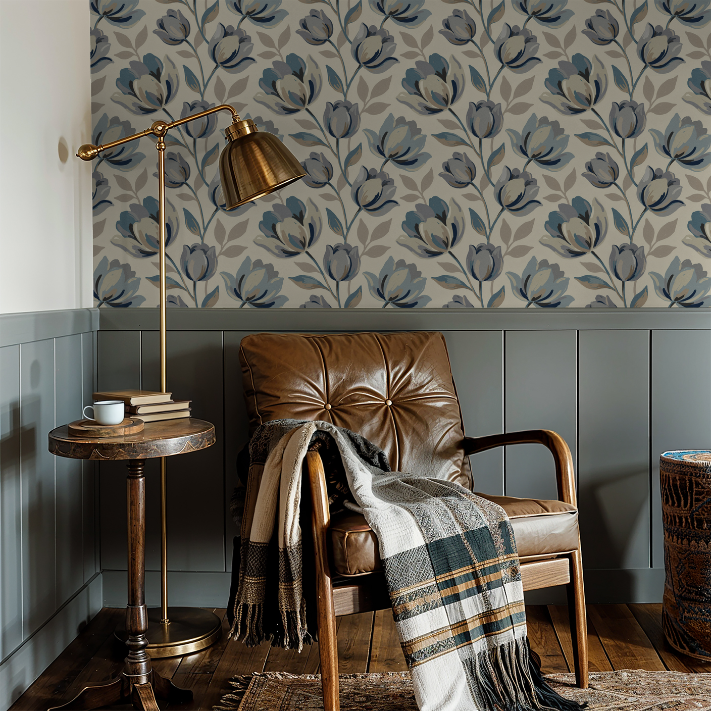 Bloomsbury floral wallpaper with blue and gray tulips in cozy reading nook with leather chair.