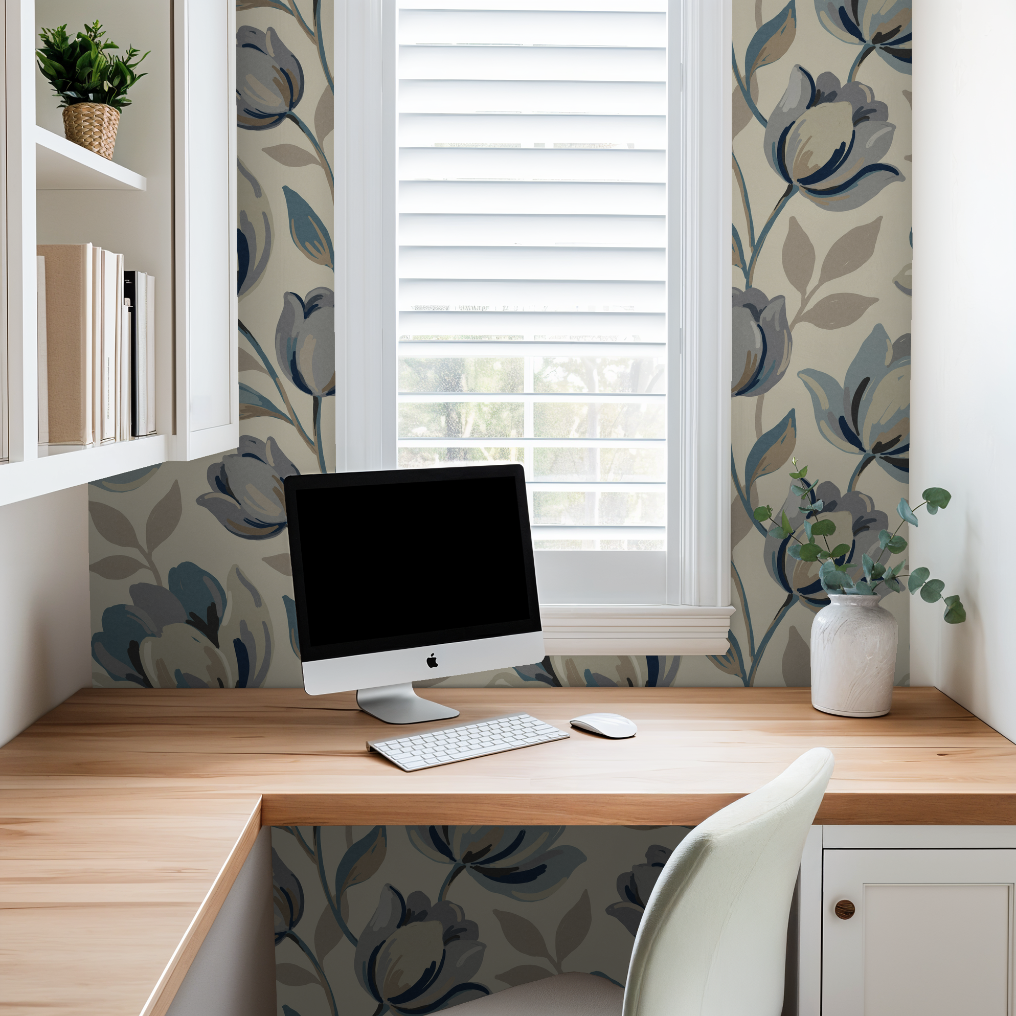 Office with Bloomsbury floral wallpaper in muted blues and grays, wooden desk.