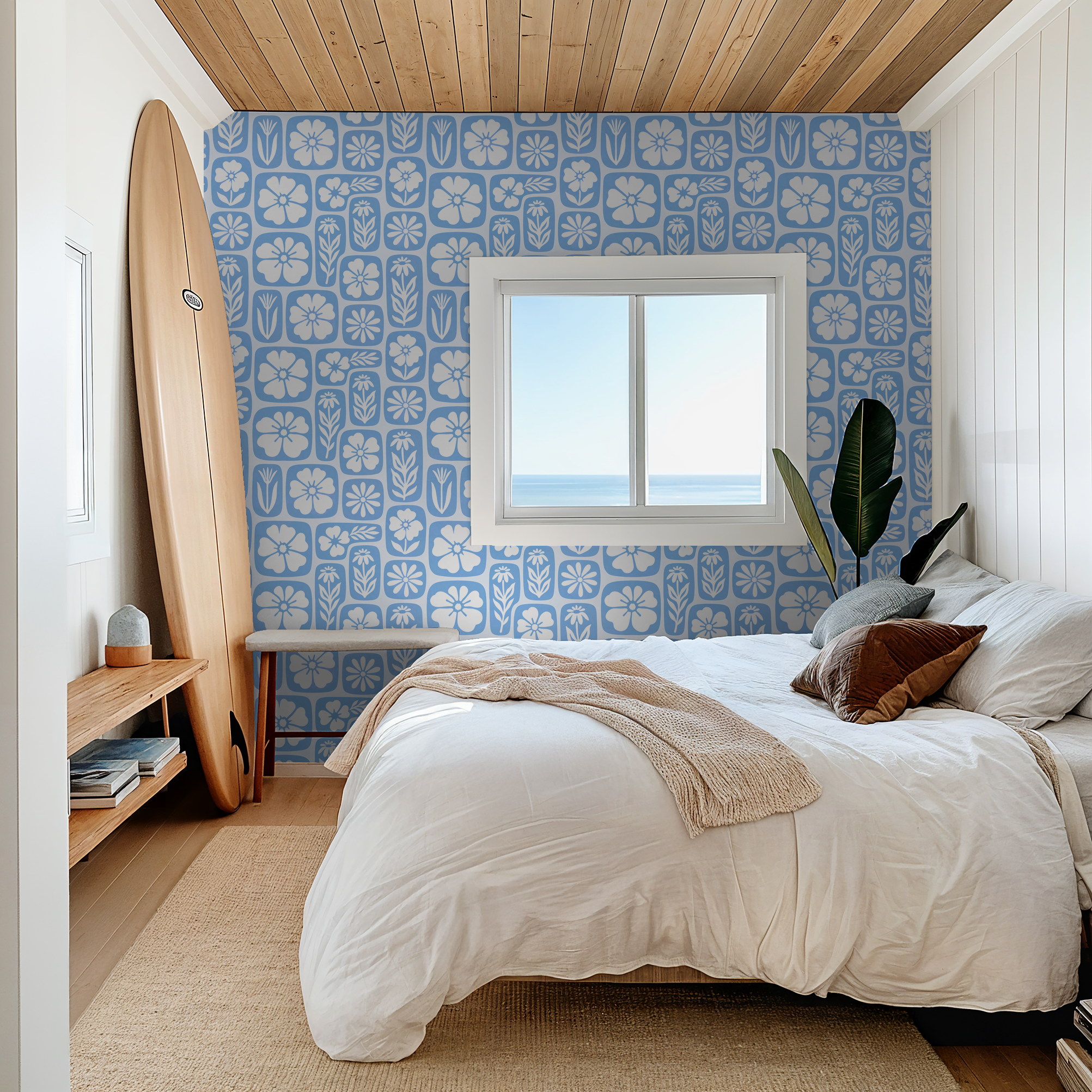 Blue floral wallpaper with white silhouettes in a cozy bedroom setting.