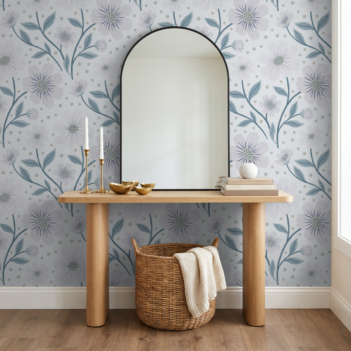 Blue floral wallpaper with lilac blooms in a modern room with mirror and wooden table.