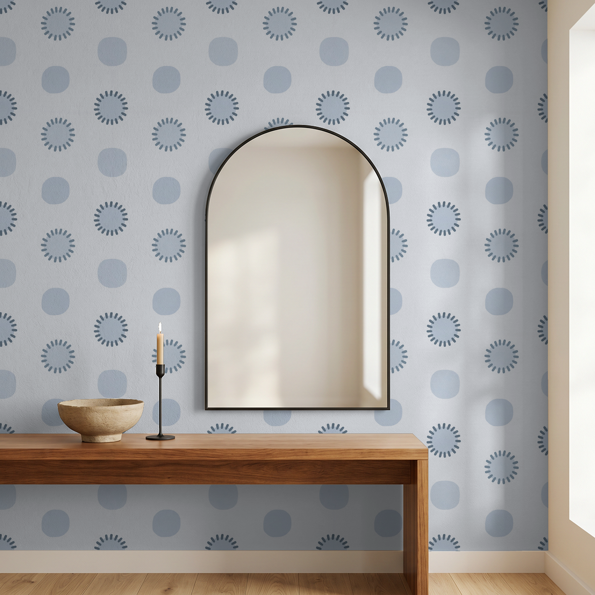 Blue geometric circle wallpaper in modern room with mirror and wooden console.
