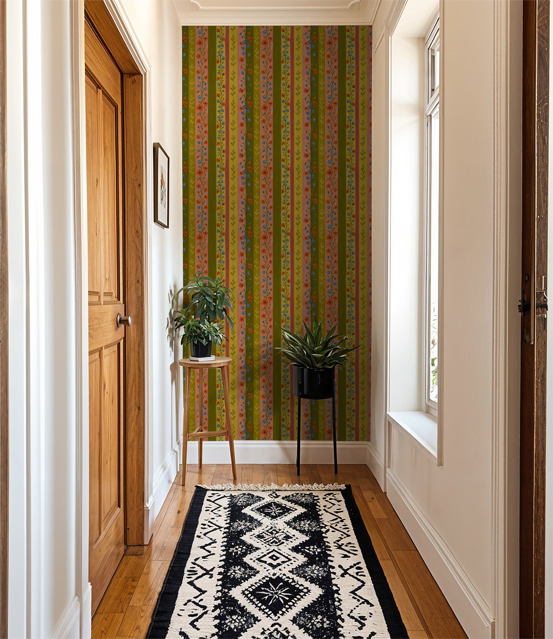 Hallway with Britta's Path wallpaper featuring olive, mustard, coral stripes and floral motifs.