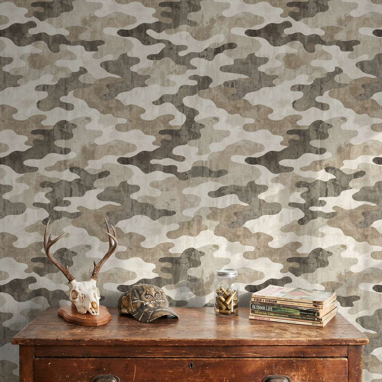Camouflage wallpaper with earth tones in a rustic room setting.