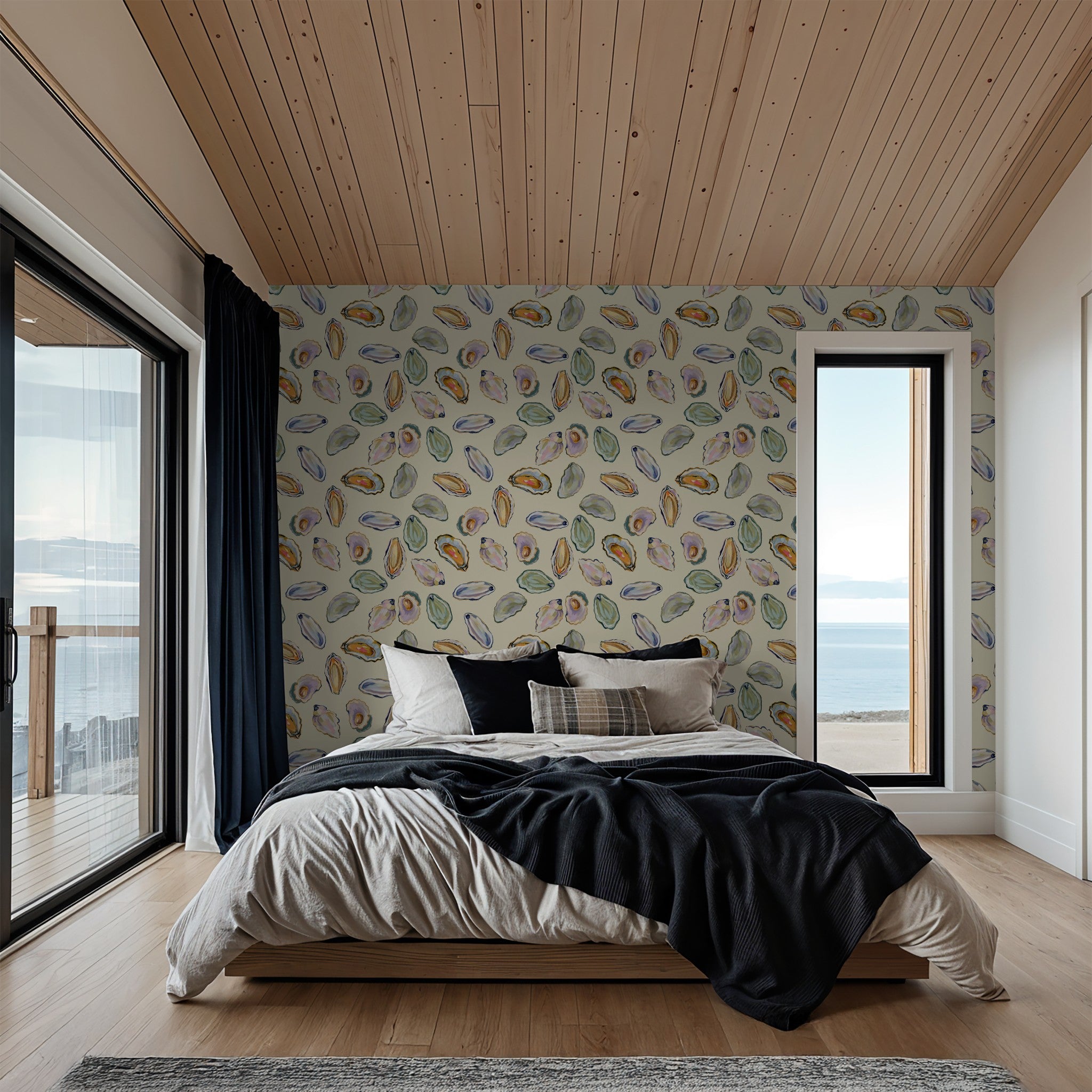 Coastal shell pattern wallpaper in serene bedroom with ocean view.
