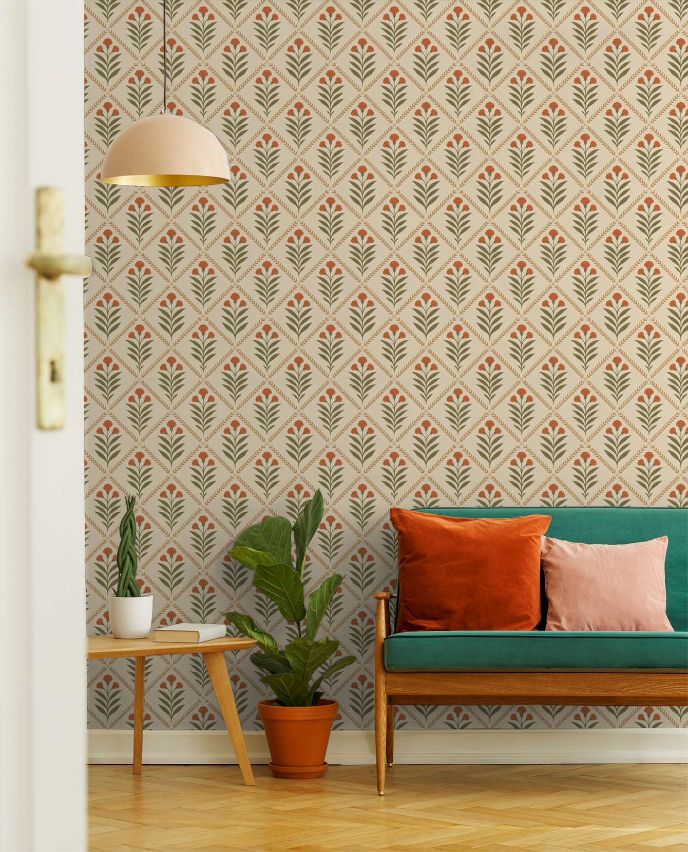 Cream wallpaper with olive green leaves and terracotta blooms in a cozy living room.