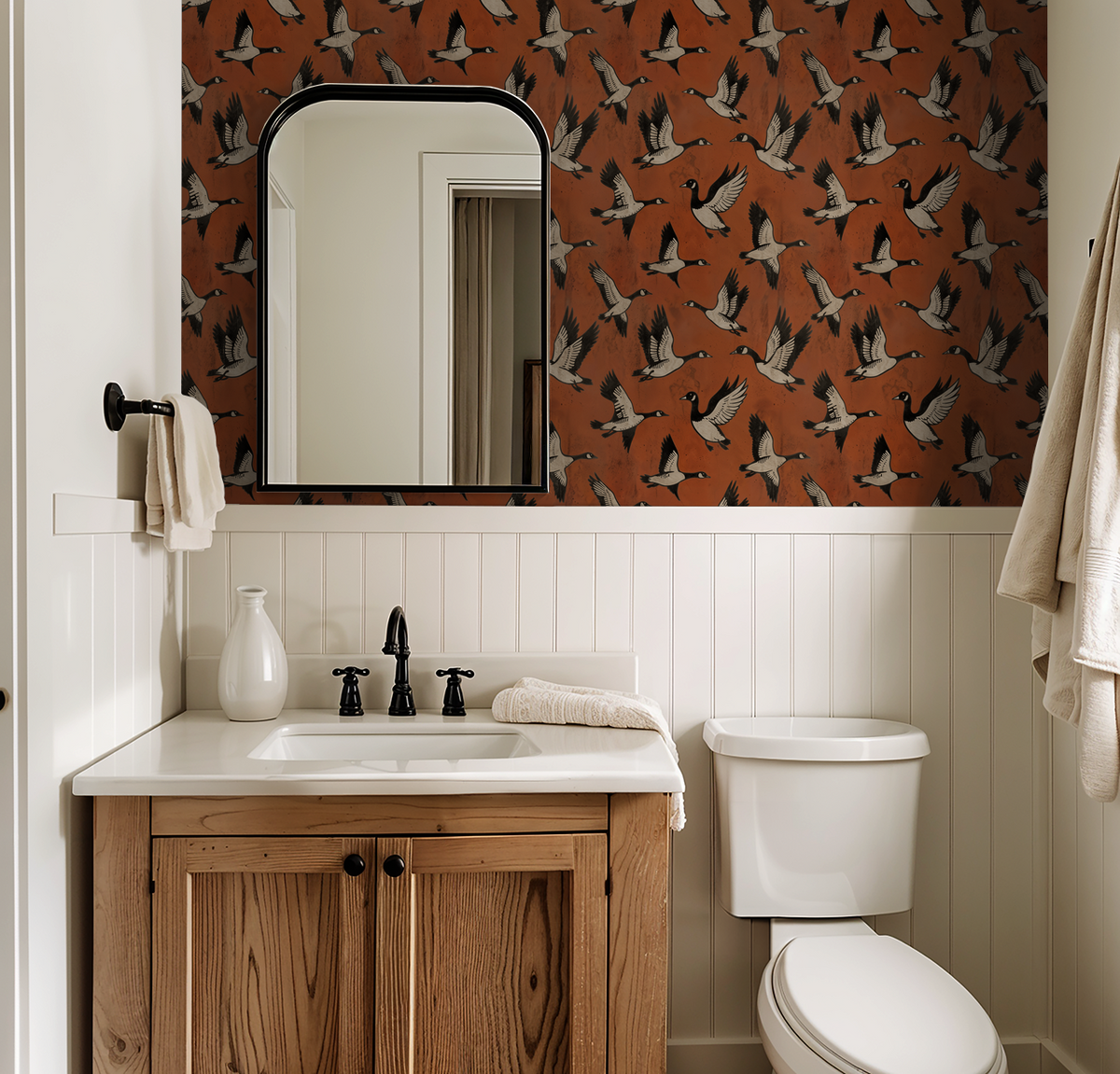 Crimson goose wallpaper in bathroom with wooden vanity and mirror.