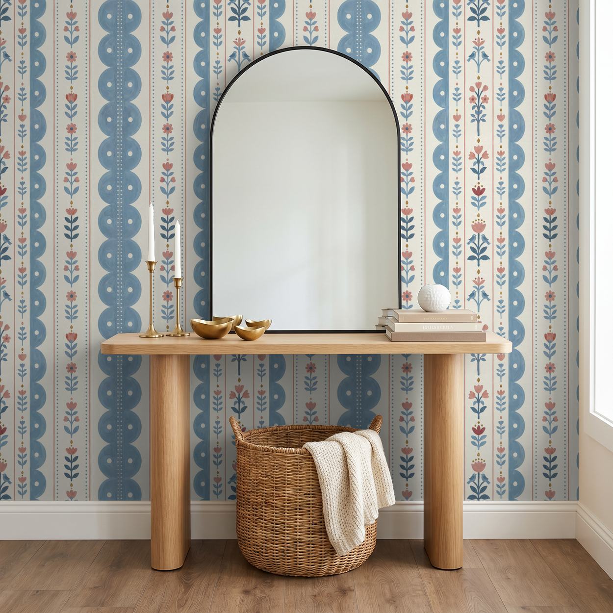 Dahlia Dreams wallpaper with blue and coral floral stripes in a cozy room with wooden console.