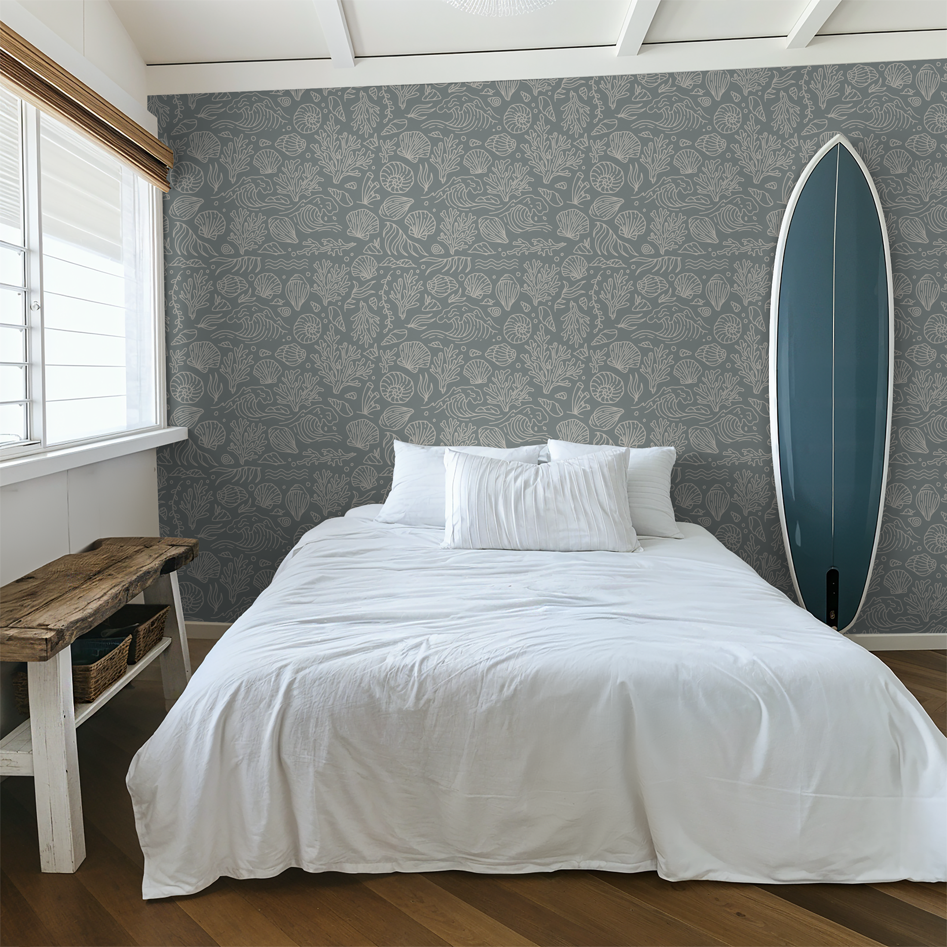 Dusty blue coastal wallpaper with seashells in serene bedroom setting.