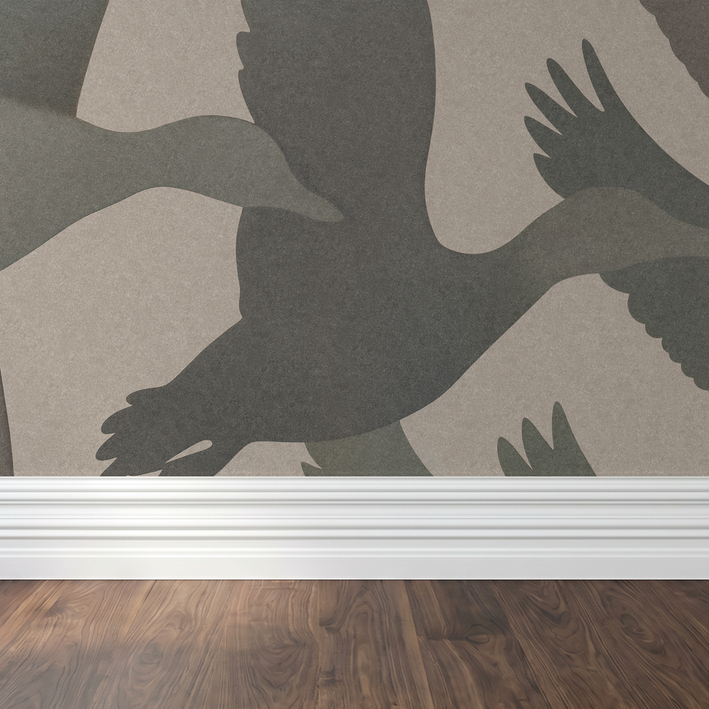 Feathered Horizon wallpaper with bird silhouettes on neutral backdrop in a room setting.