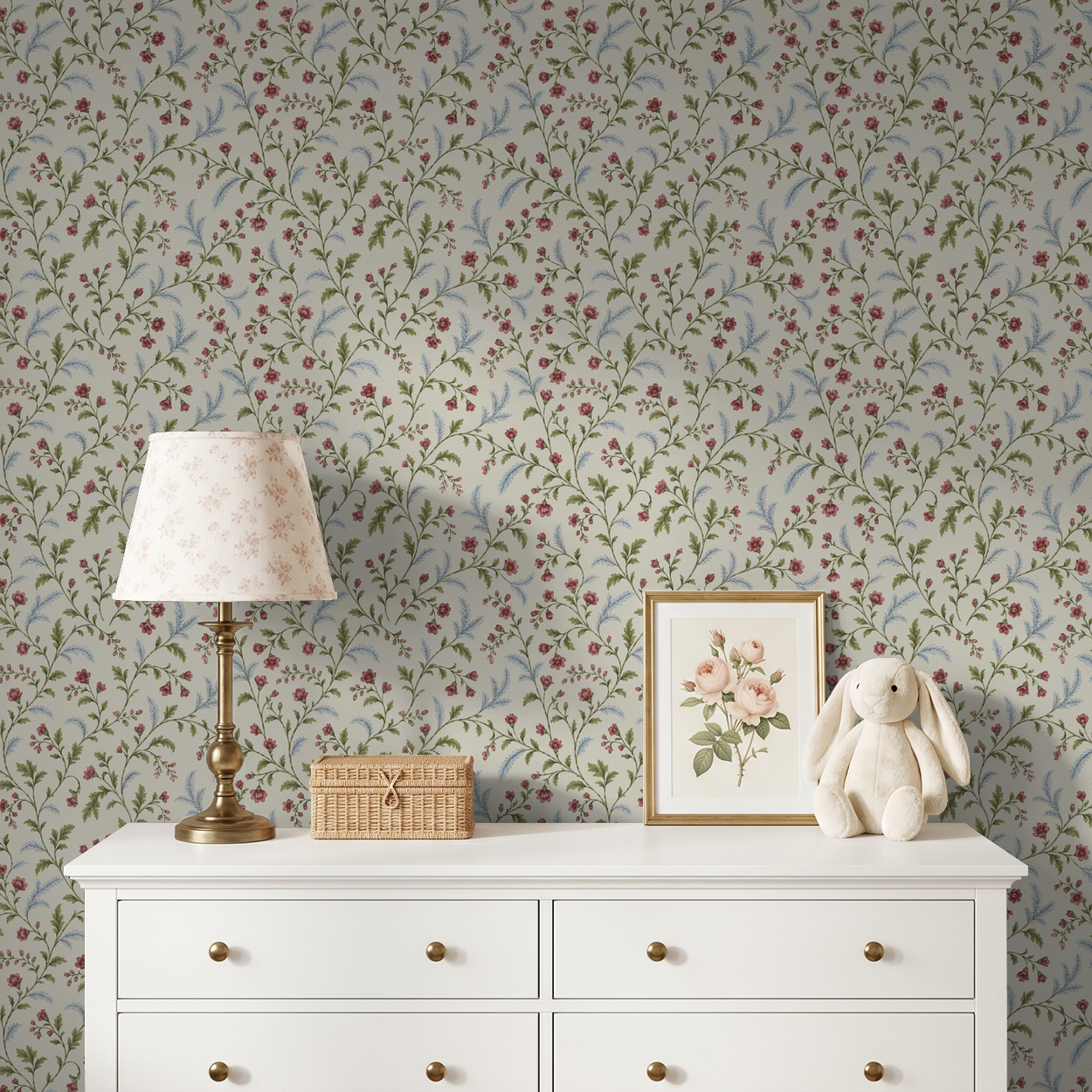 Floral wallpaper with pink blossoms and green leaves in a vintage nursery setting.