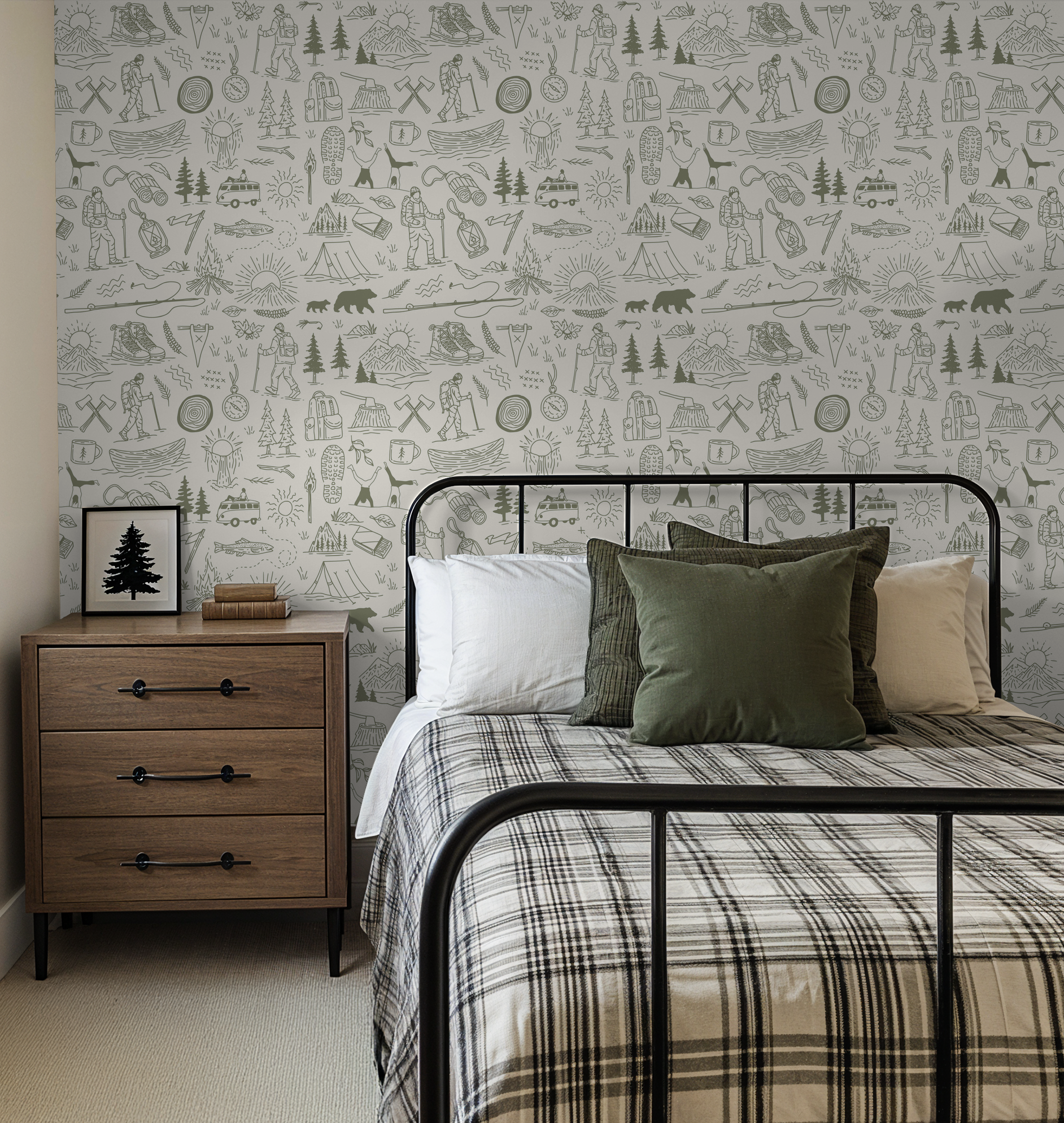 Green and cream nature-themed wallpaper in a cozy bedroom with rustic decor.