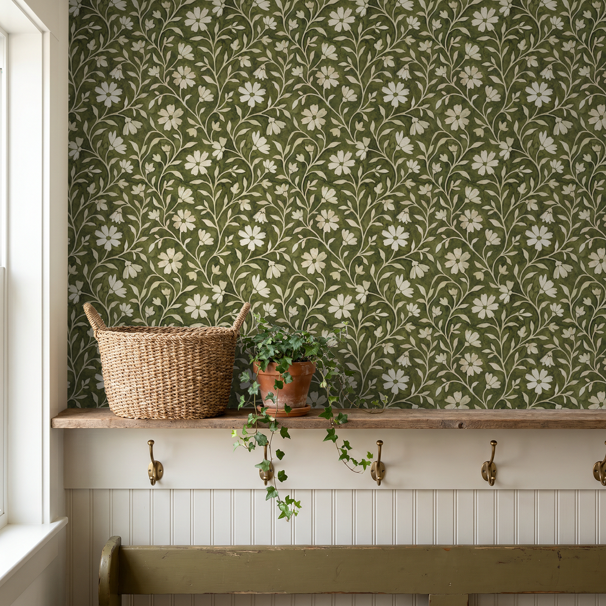 Green floral wallpaper with cream flowers in rustic room setting.