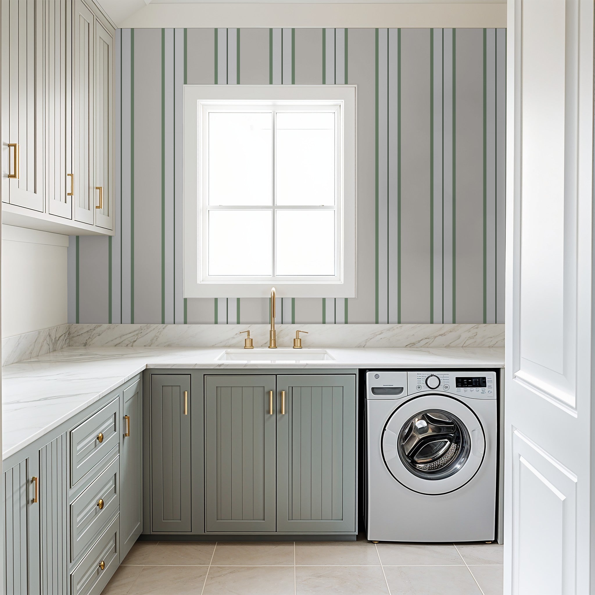 Laundry room with green striped wallpaper and modern cabinetry.