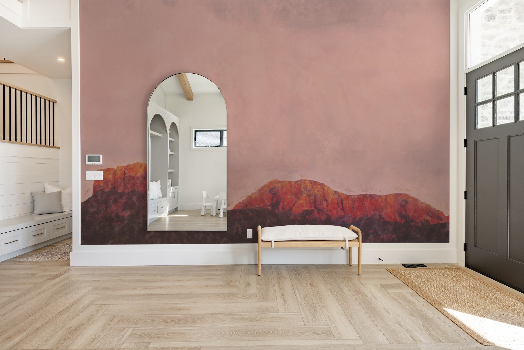 Heart Thief wallpaper with pink and orange desert landscape in modern entryway.