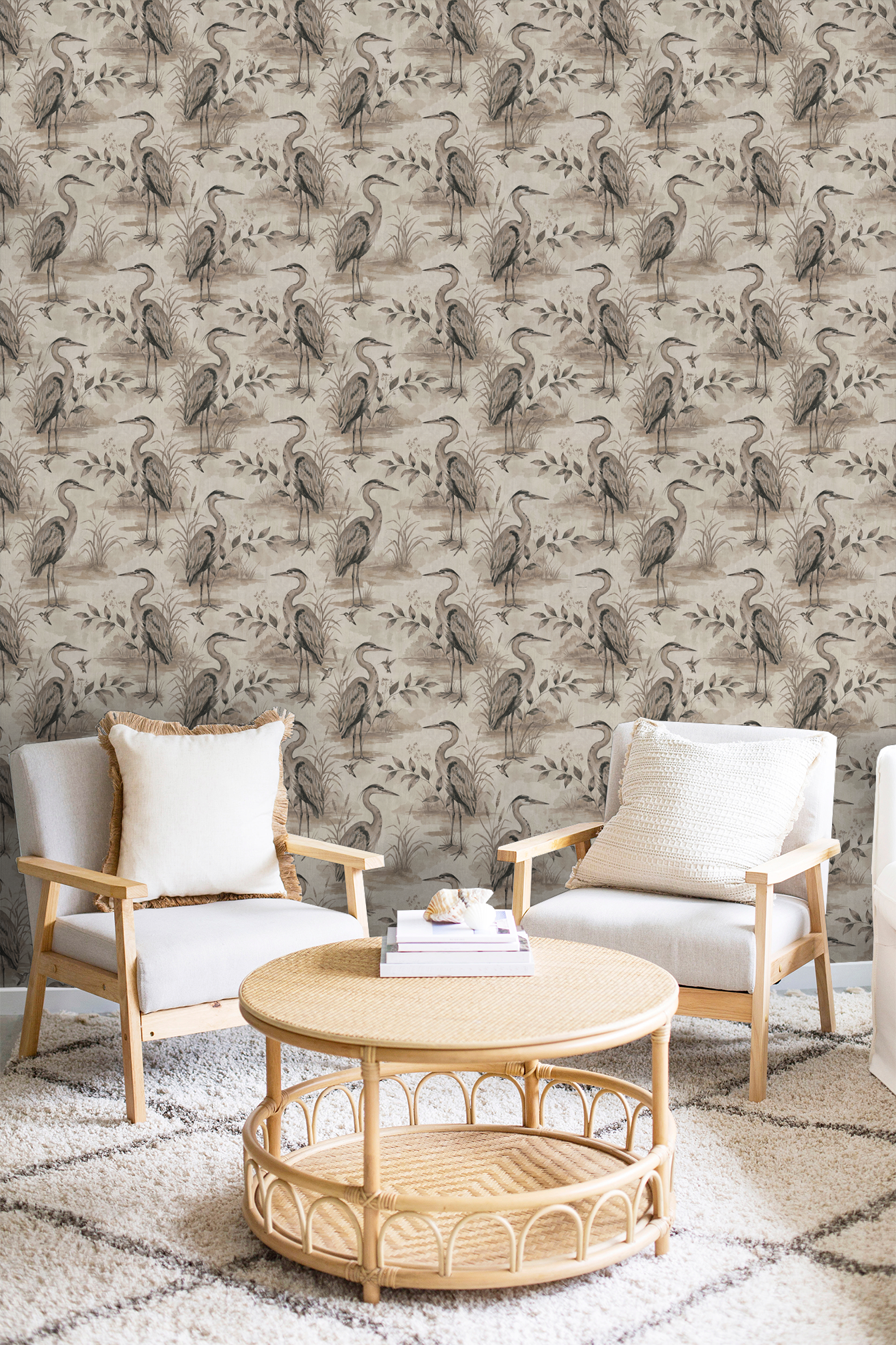 Heron Lake wallpaper with taupe herons and foliage in cozy living room setting.