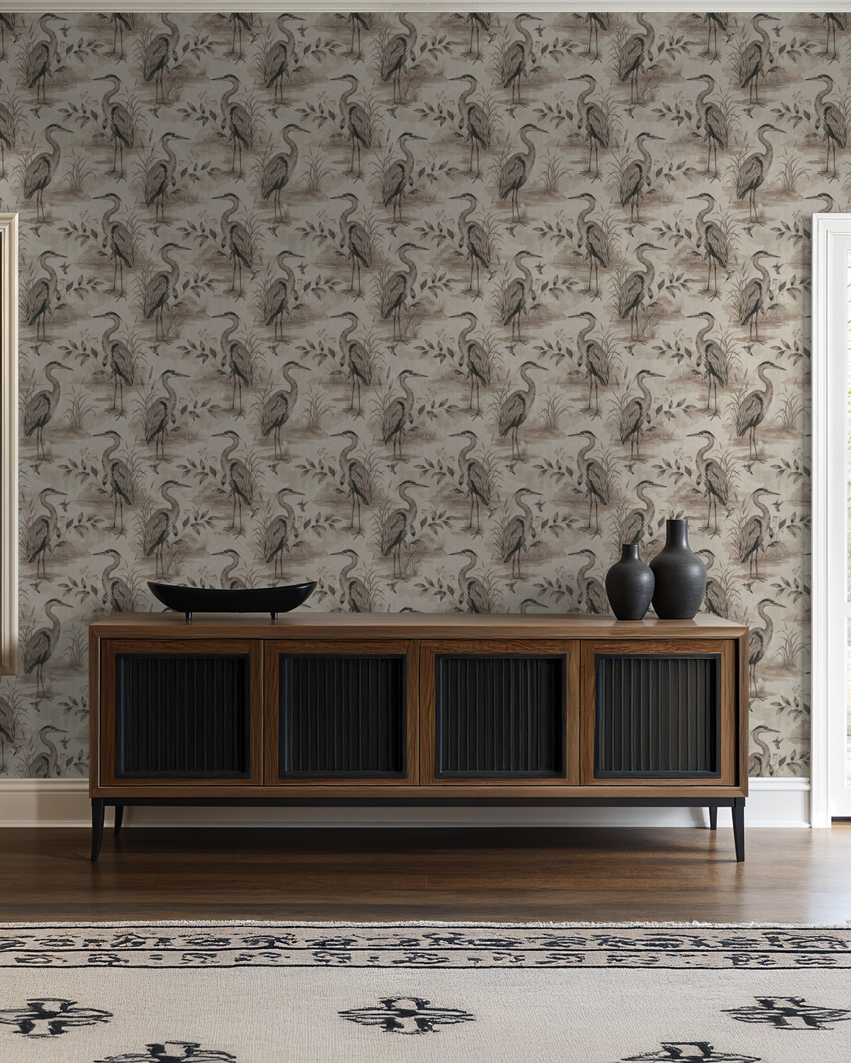 Heron Lake wallpaper with taupe herons and foliage in a rustic living room setting.