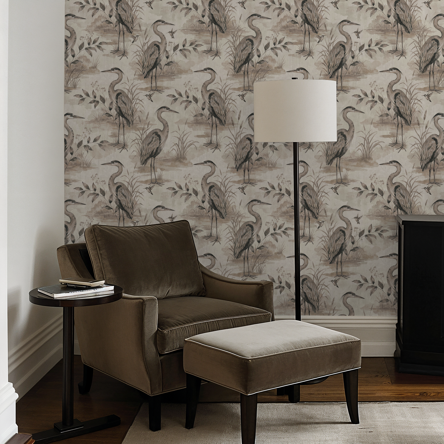 Heron Lake wallpaper with herons and foliage in taupe and sepia in a cozy living room.