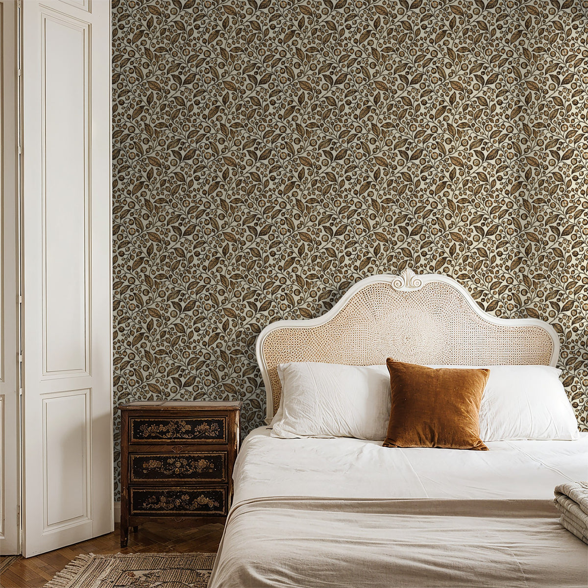 Honeyed Hollow wallpaper with intricate floral motifs in a cozy bedroom setting.