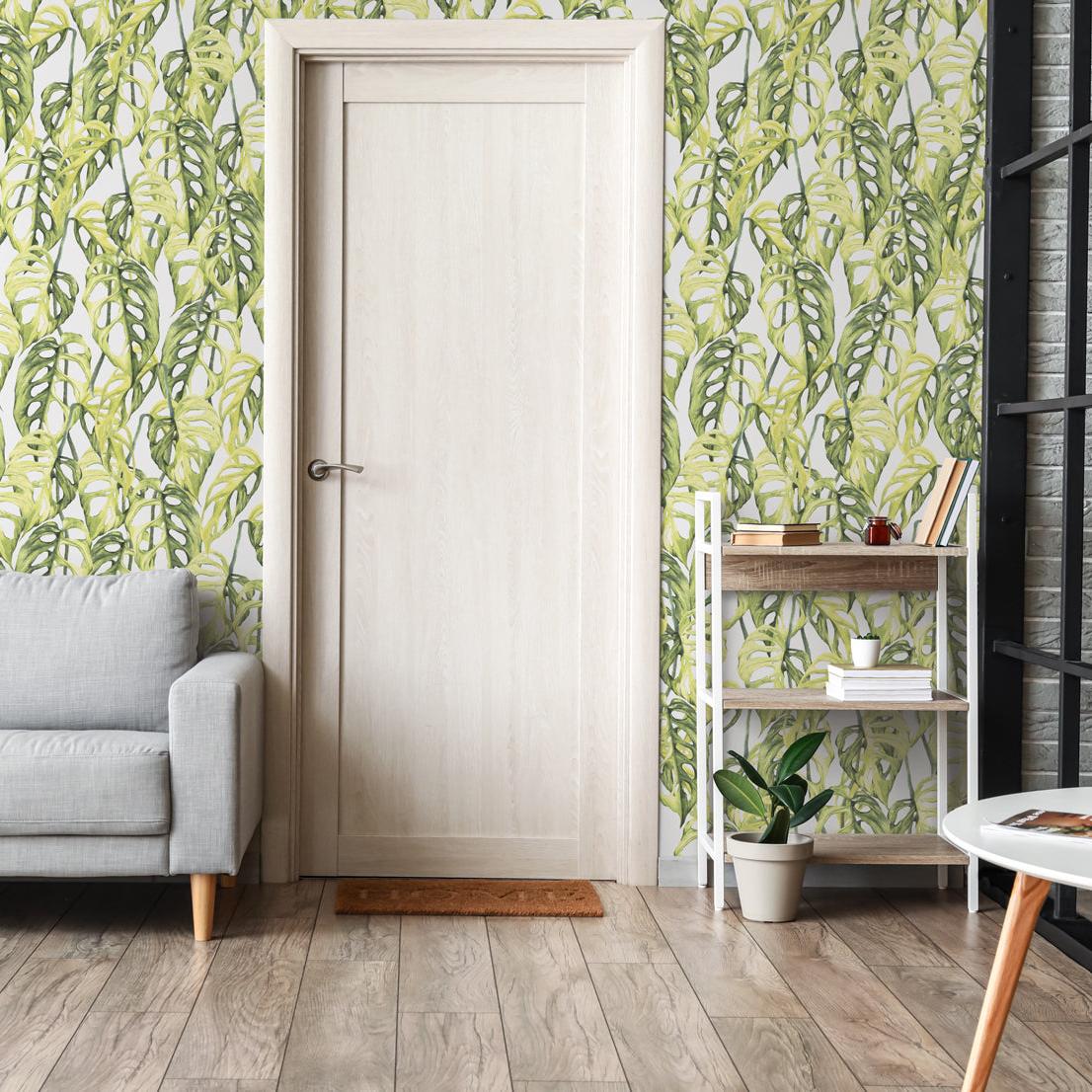 Virdis Wallpaper by The Nida Jahain Line in a modern living room, showcasing botanical patterns.
