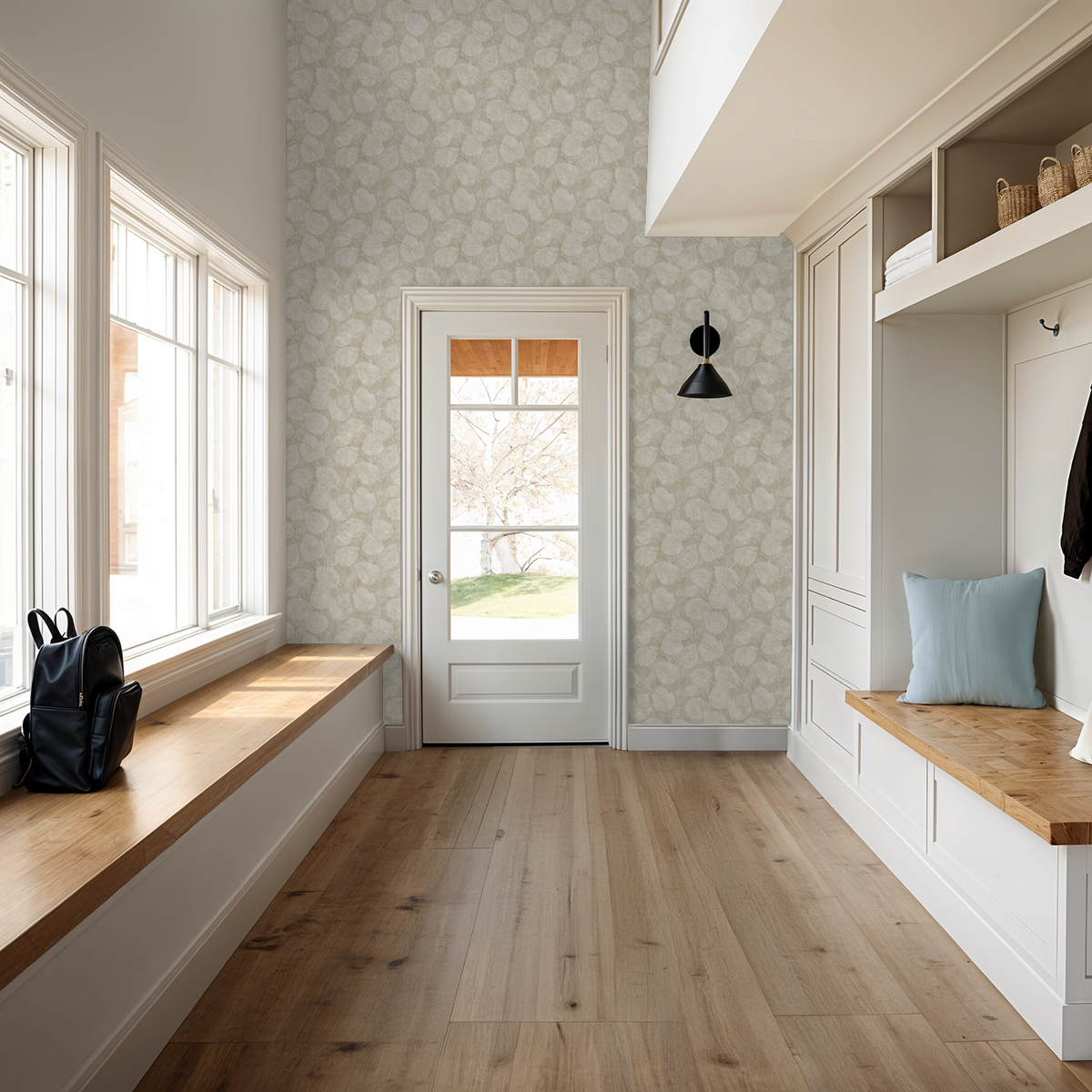 Entryway with light floral wallpaper and wooden bench seating