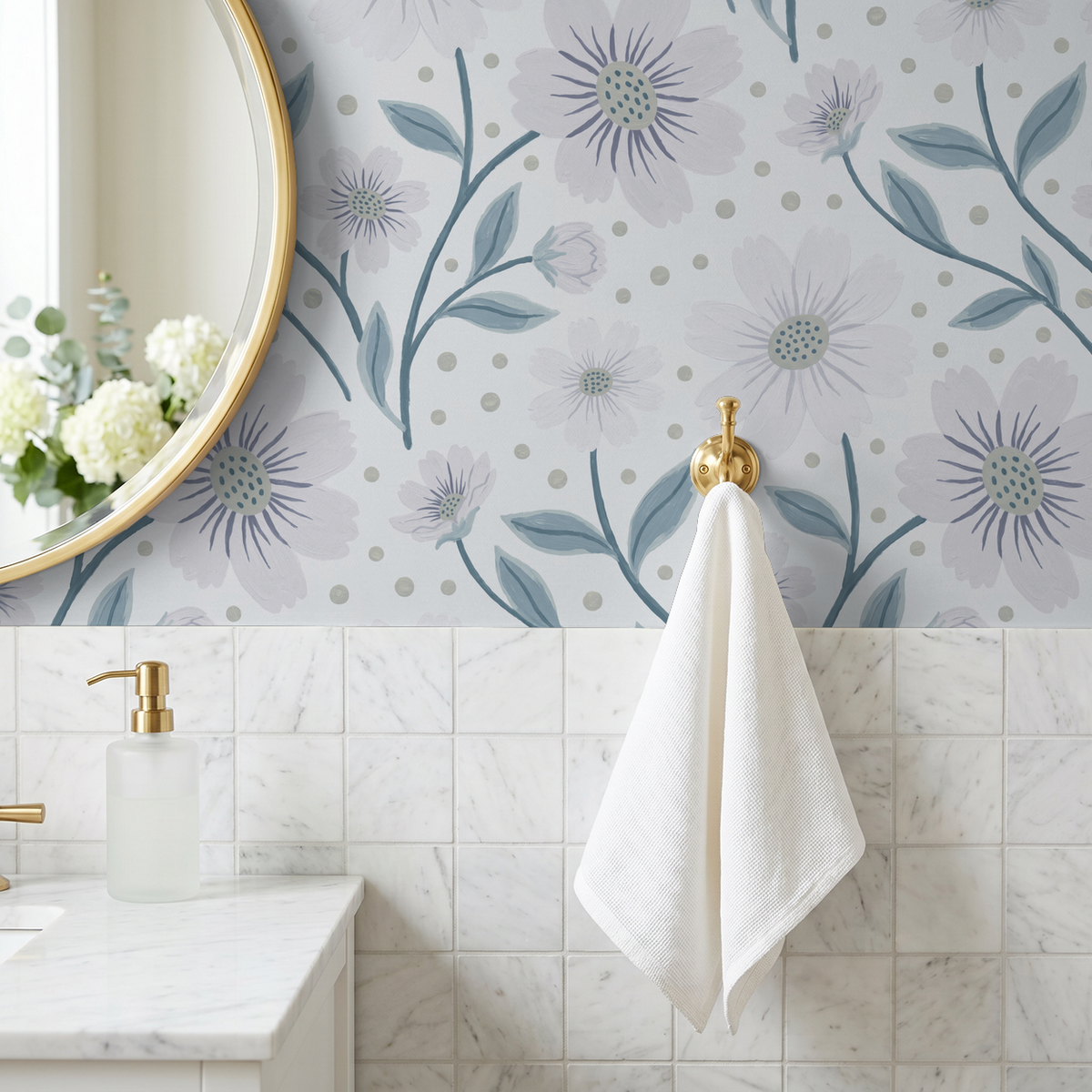 Lilac floral wallpaper in bathroom with gold mirror and white towel