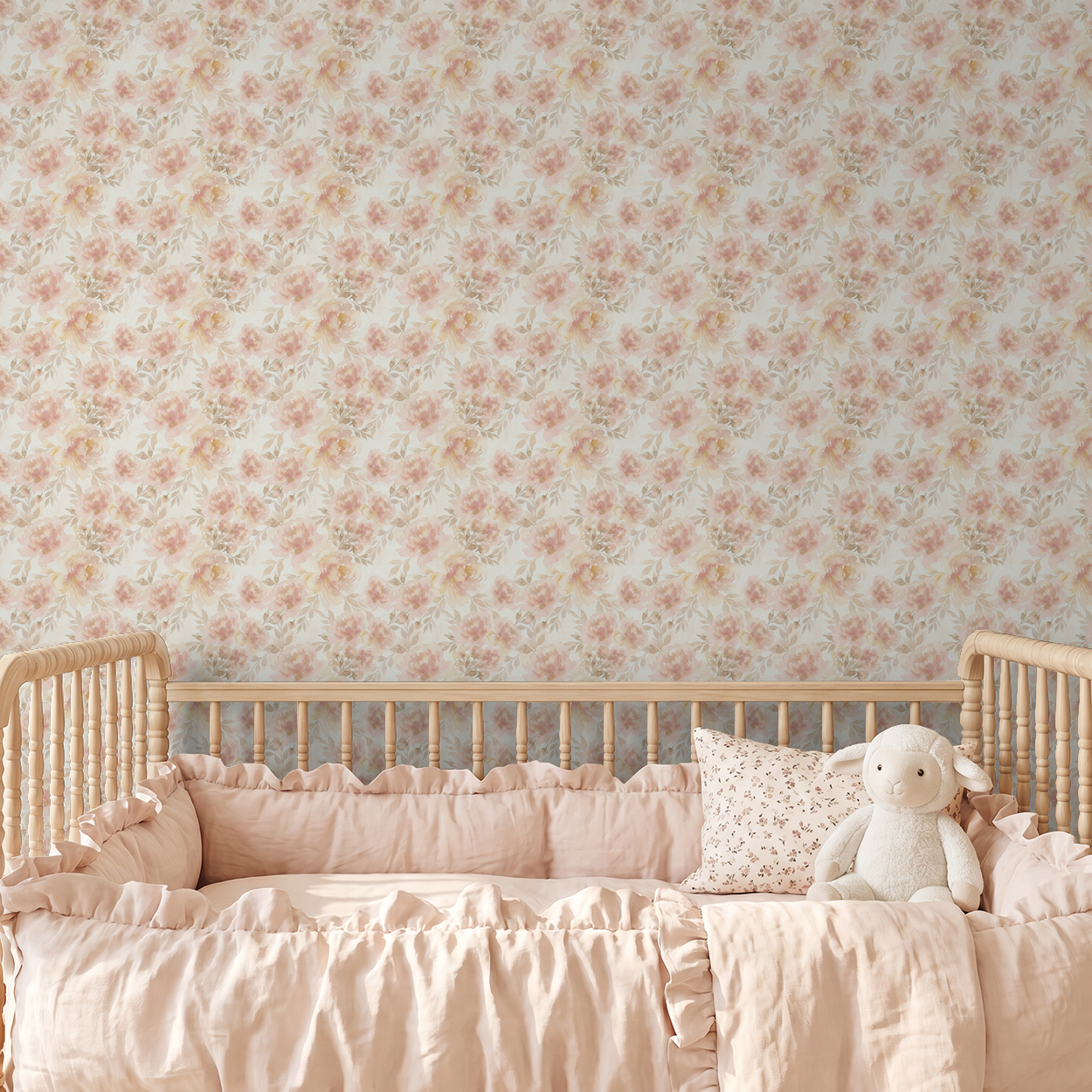 Mabel Floral wallpaper with blush and cream flowers in a nursery setting.