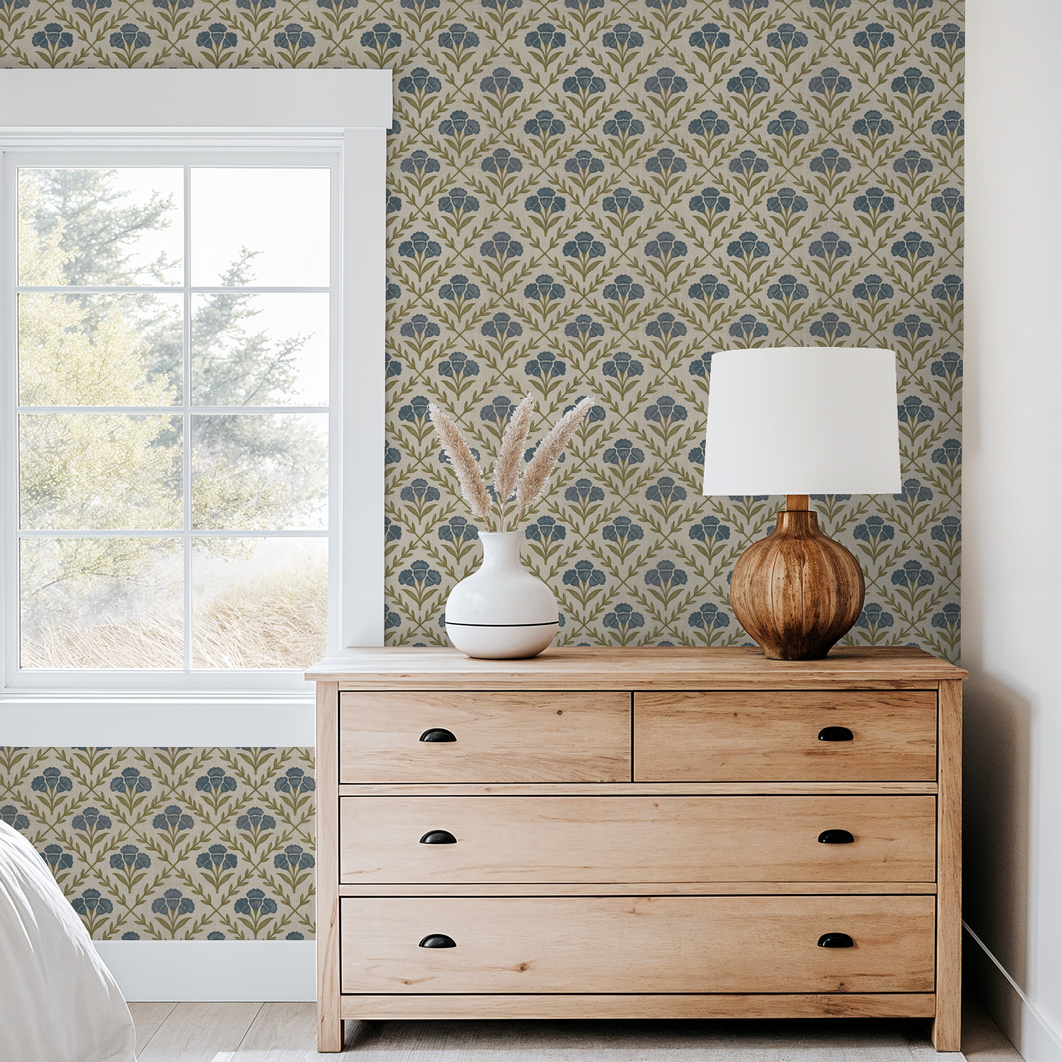 Marielos wallpaper with blue and olive floral pattern in cozy bedroom setting.
