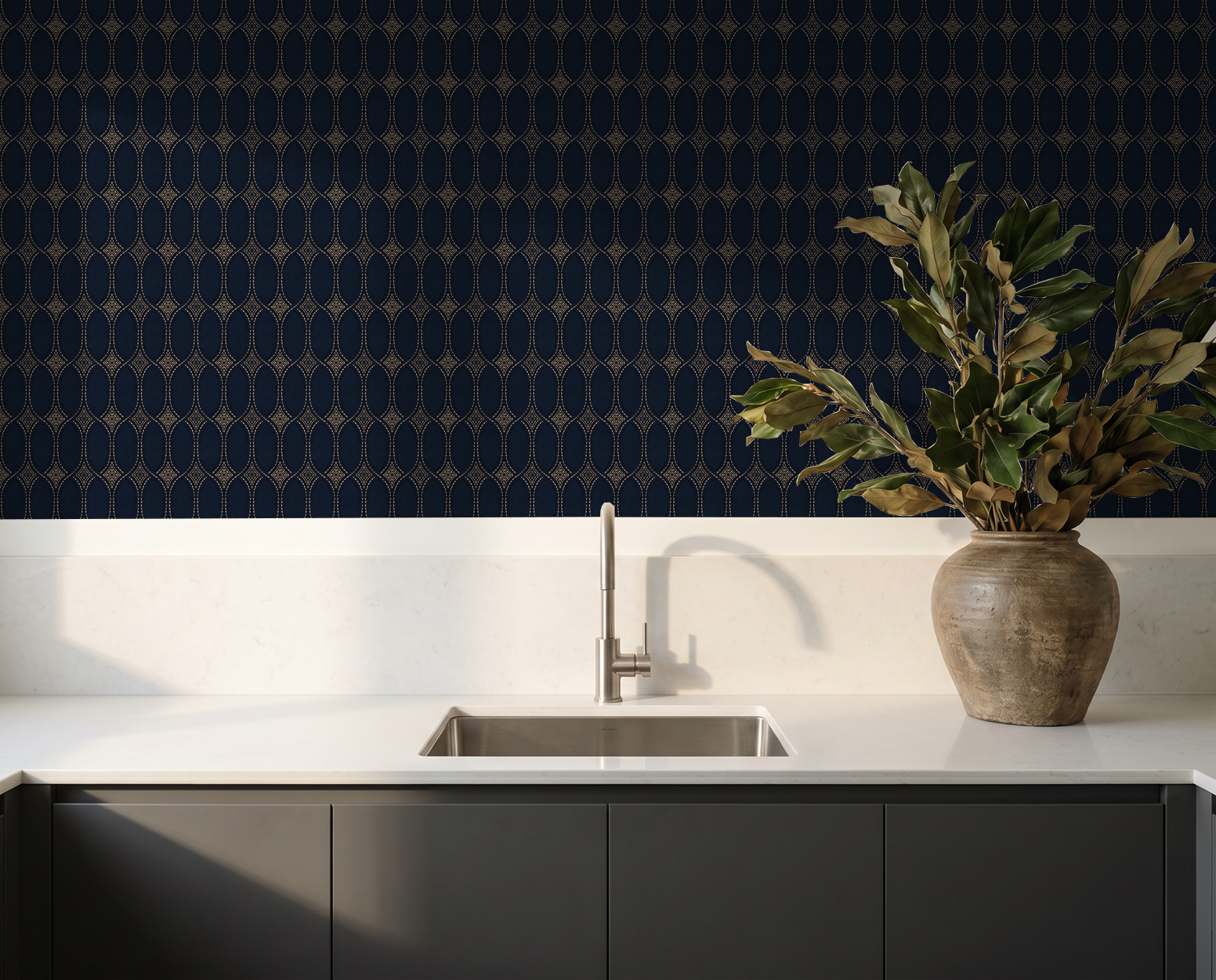 Navy and gold geometric wallpaper in modern kitchen with vase on counter.