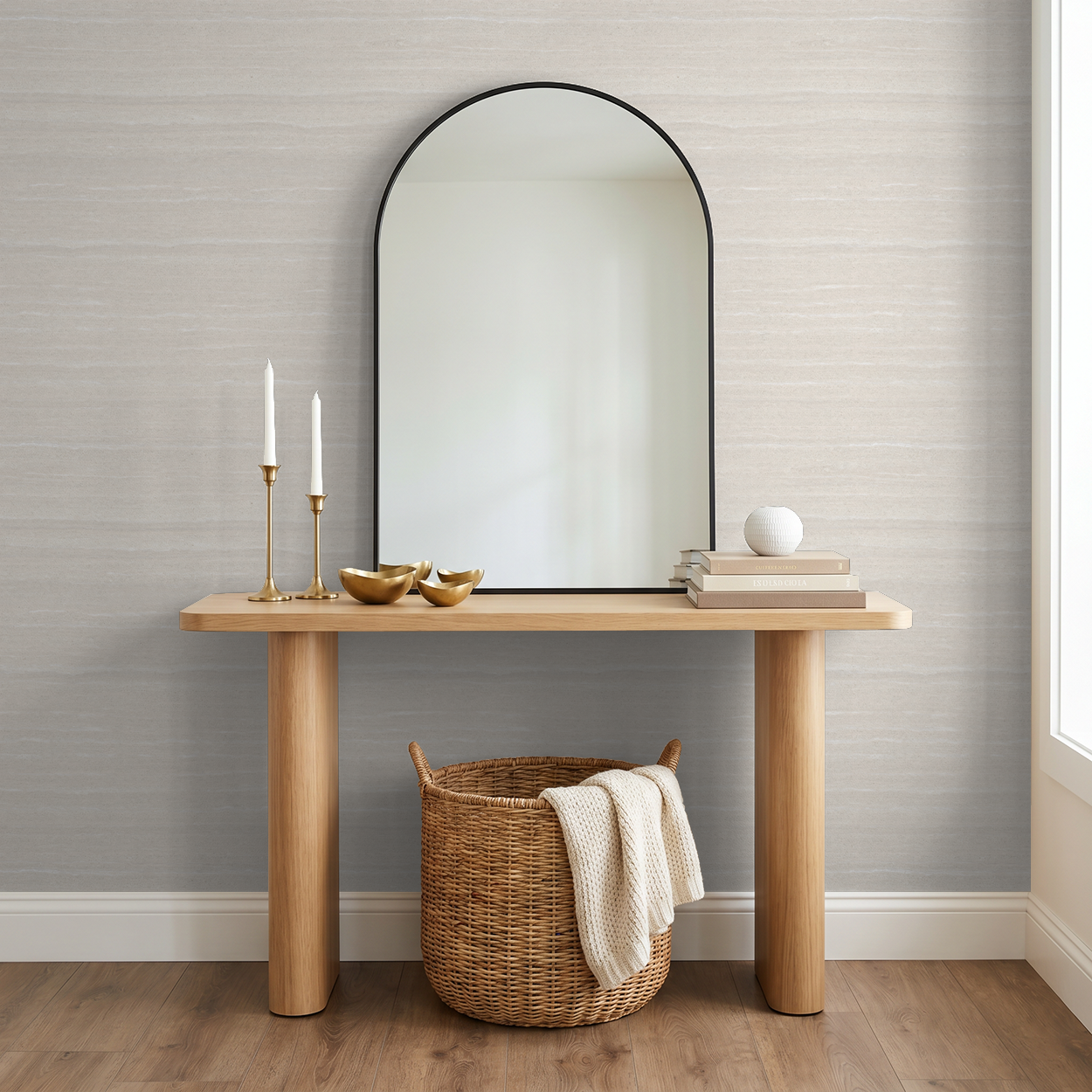 Neutral textured wallpaper in modern entryway with wooden console and mirror