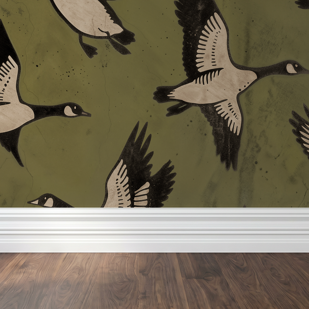 Olive green wallpaper with flying bird silhouettes above wooden floor and white trim.