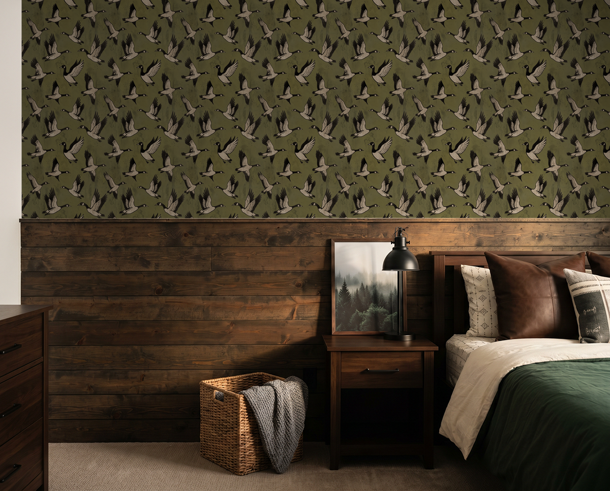 Olive green wallpaper with bird silhouettes in rustic bedroom setting.