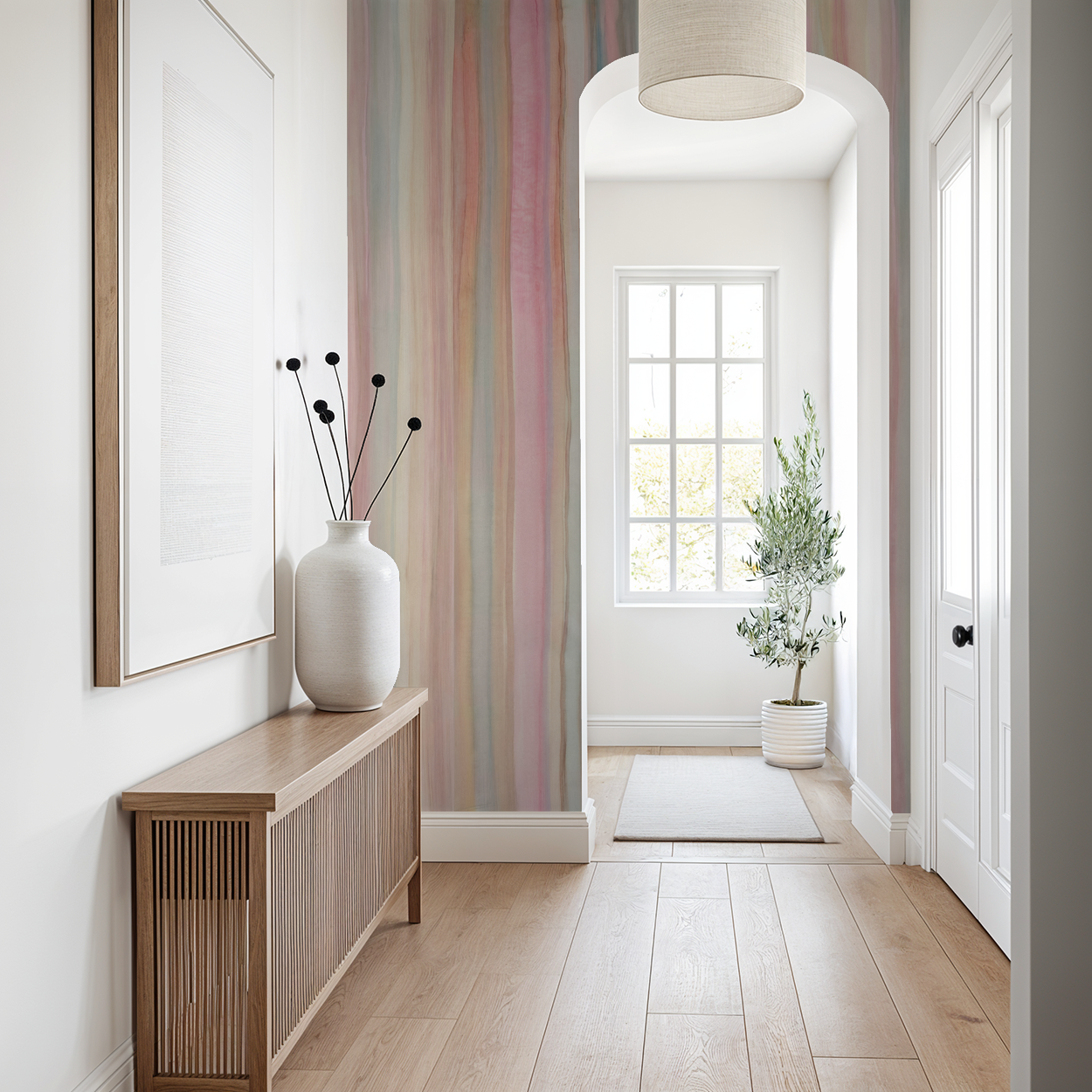 Pastel flowing line wallpaper in serene hallway with wooden console and potted plant.