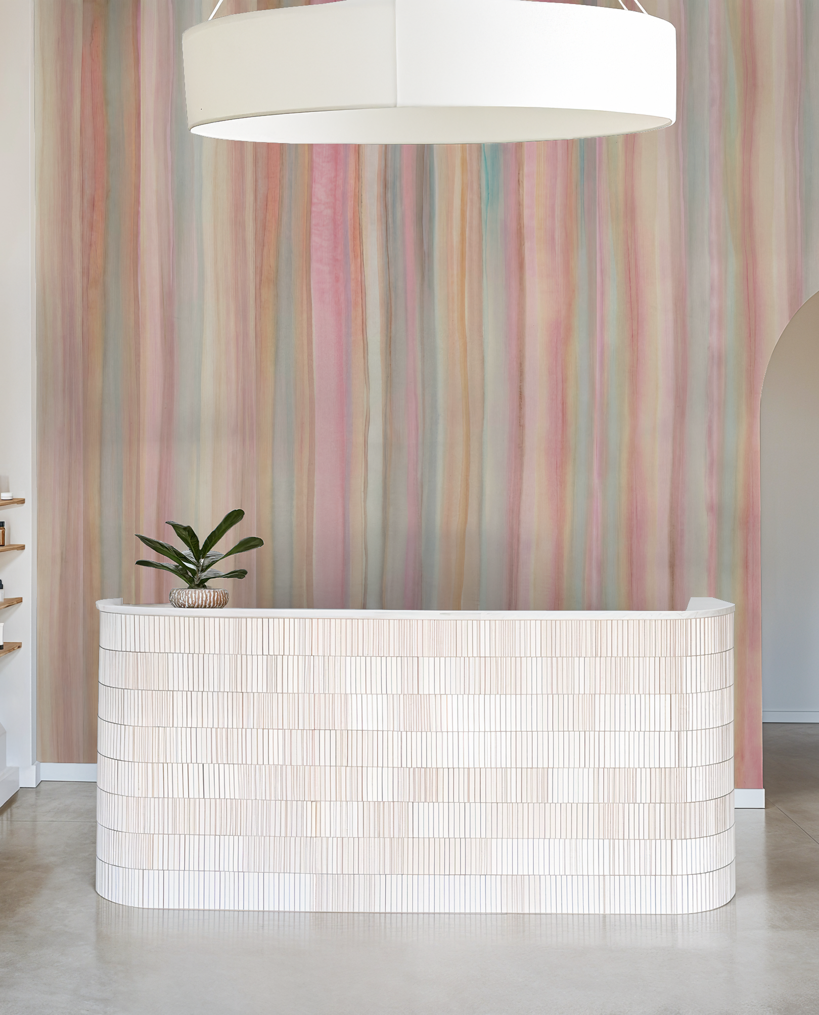 Pastel striped wallpaper in modern room with white counter and plant.